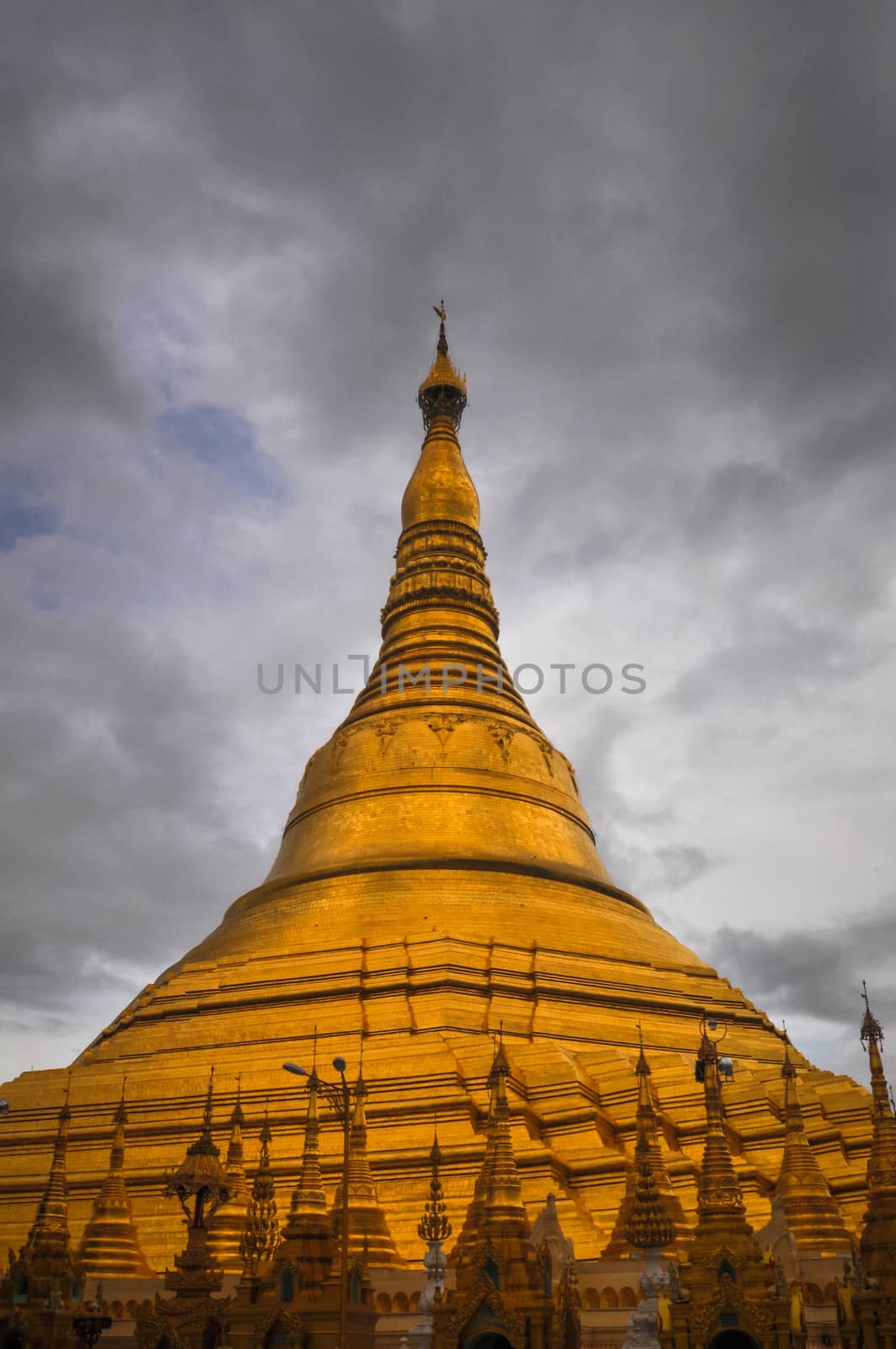 Shwedagon Pagoda shining in the beautiful sunset in Yangon, Myan by weltreisendertj