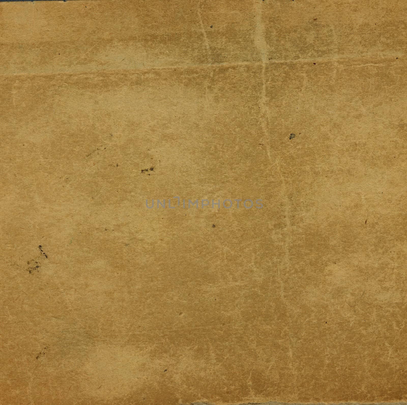 Blank sheet of old brown paper useful as a background