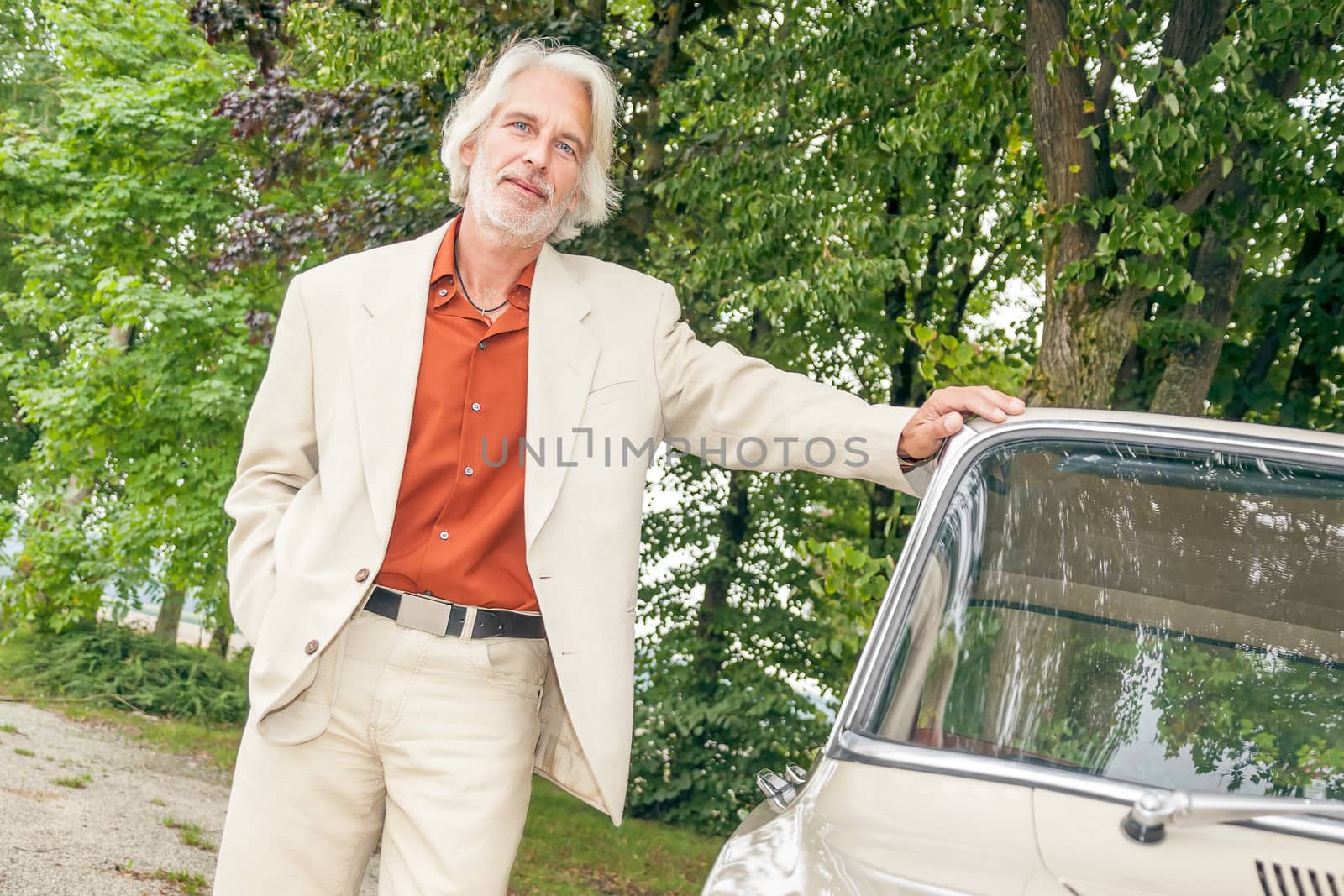 An image of a man and his car