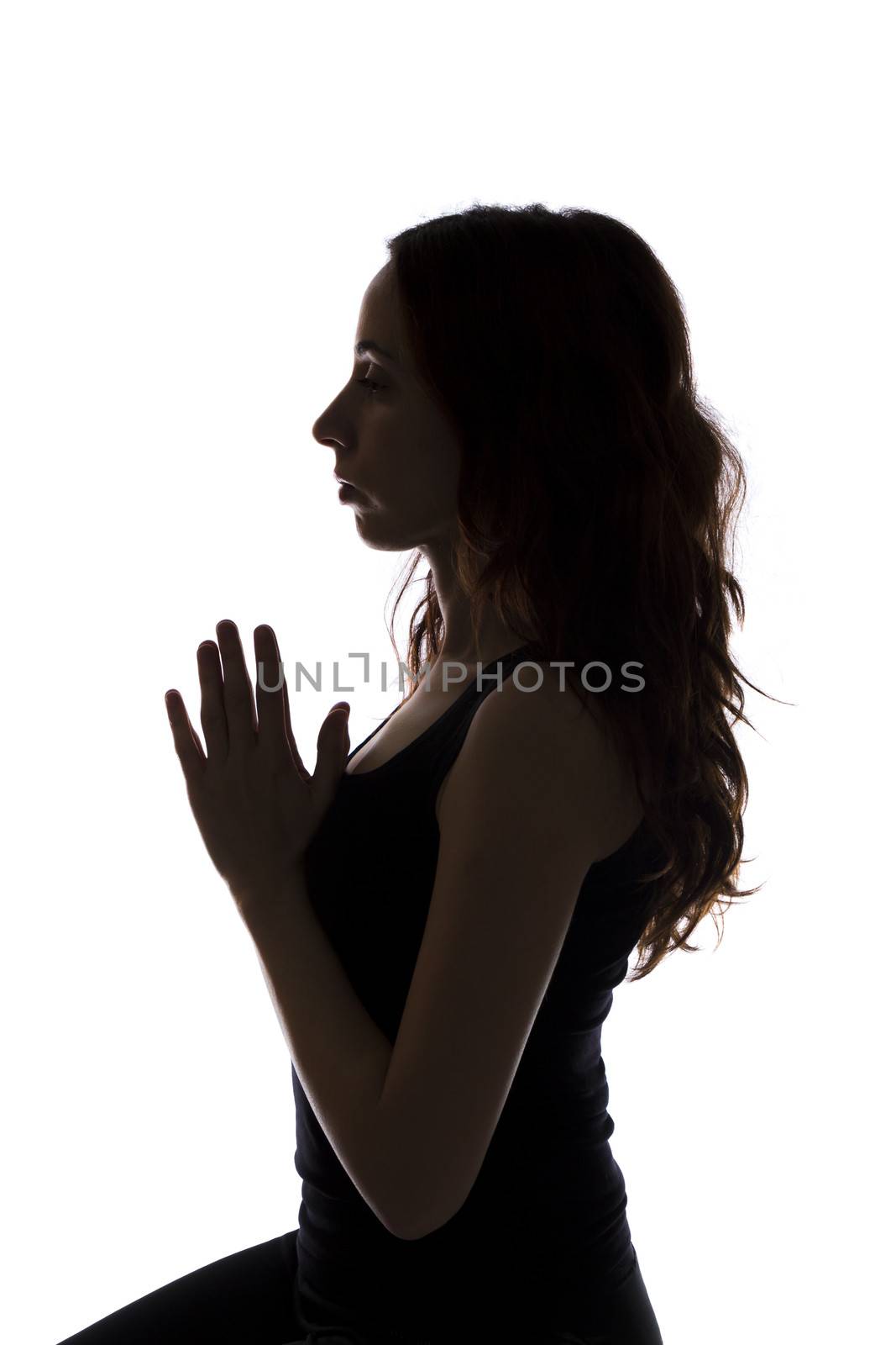 Woman in meditation, silhouette by snowwhite
