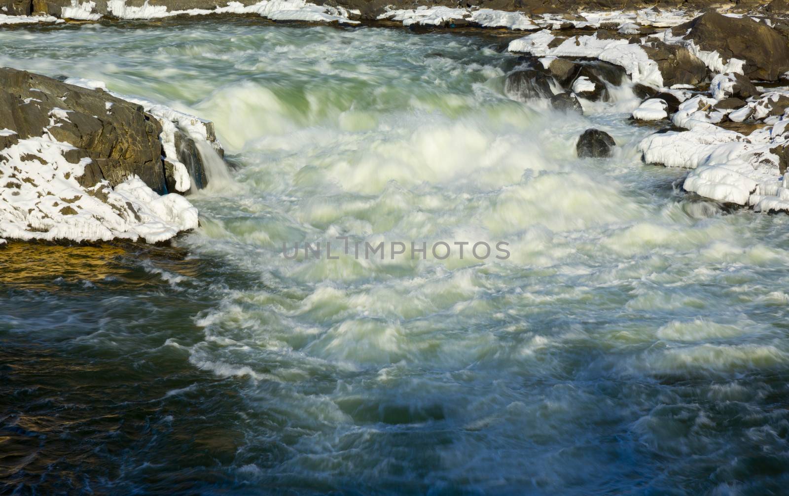 Great Falls on Potomac river outside Washington DC in winter with ice forming on the cascades and snow on the rocks
