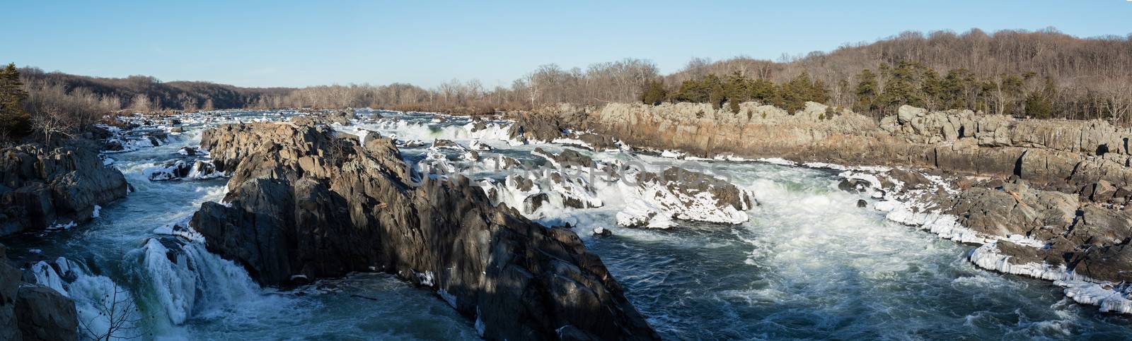 Panorama of Great Falls on Potomac river outside Washington DC in winter with ice forming on the cascades and snow on the rocks
