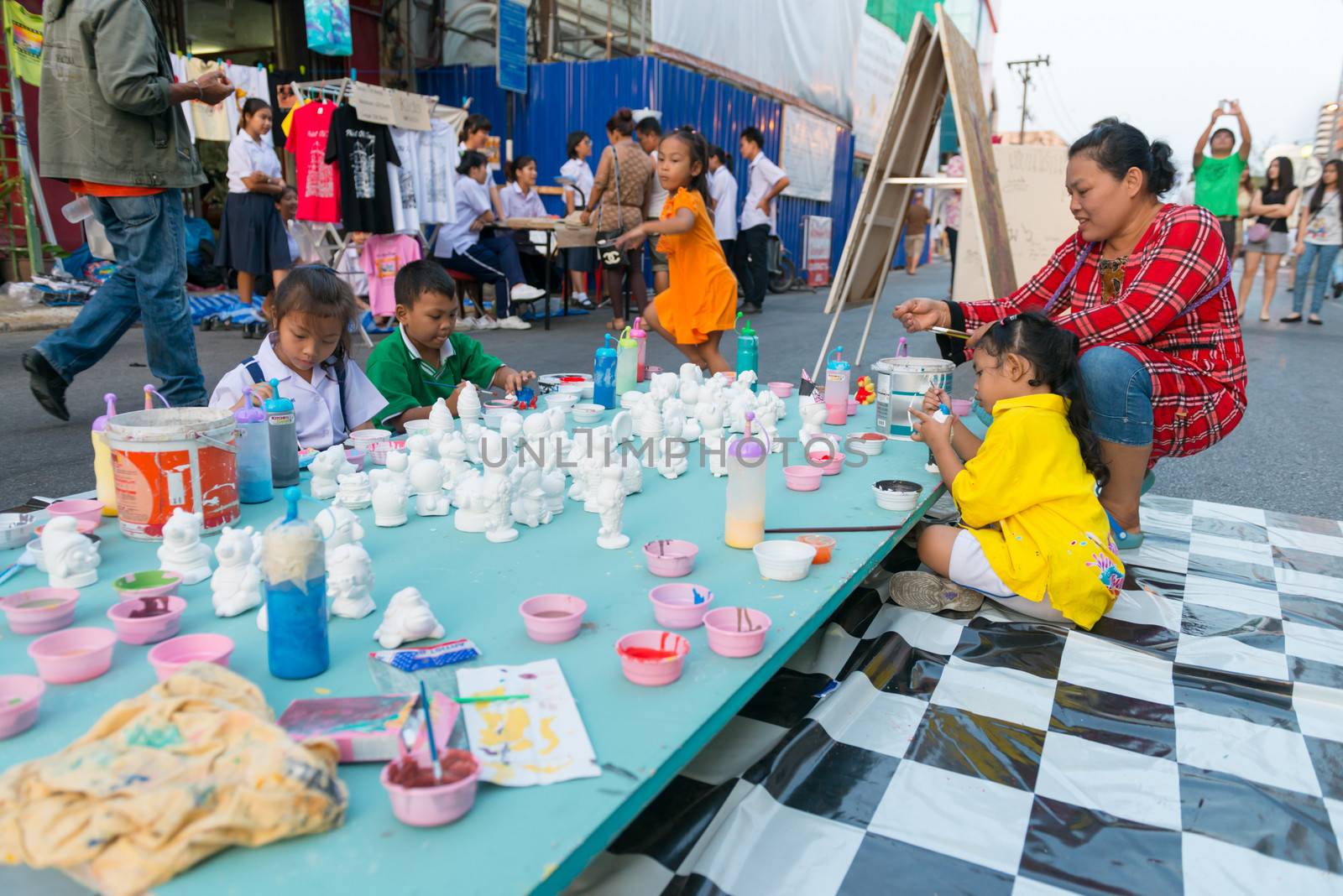 PHUKET, THAILAND - 07 FEB 2014: Unidentified kids play on the central street during annual old Phuket town festival. 