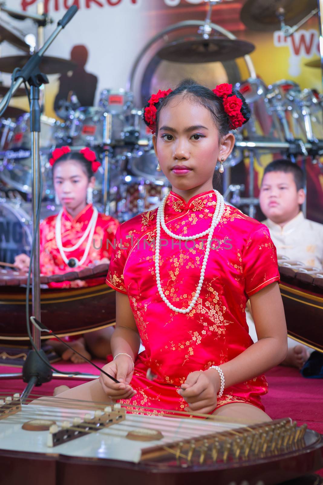 PHUKET, THAILAND - 07 FEB 2014: Unidentified musician(s) play on a stage during annual old Phuket town festival. 