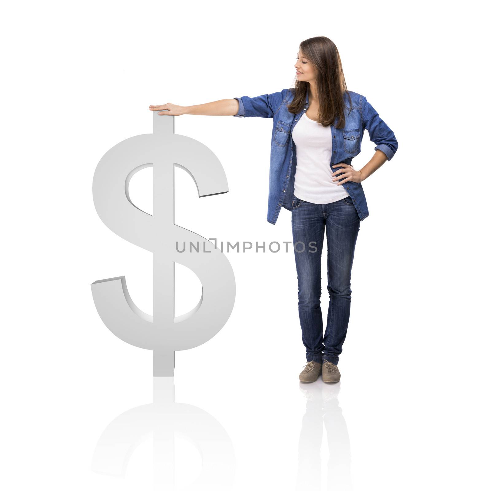 Beautiful woman standing over a Dollar symbol, isolated over a white background