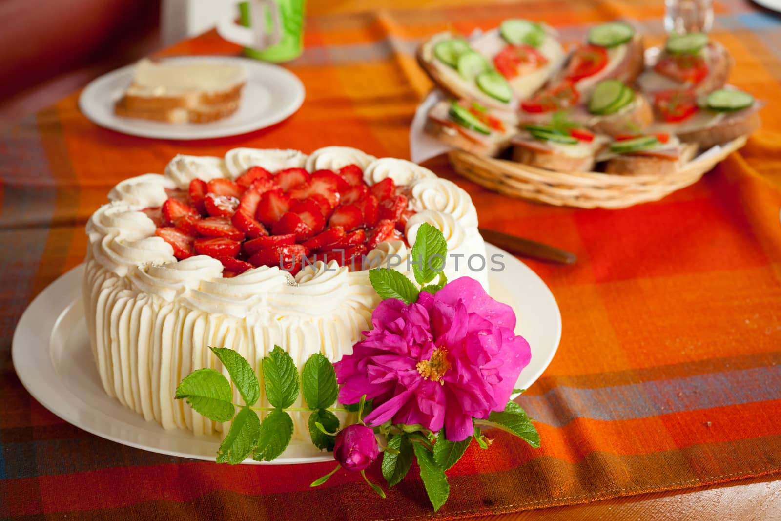 Delicious strawberry cake on coffee table