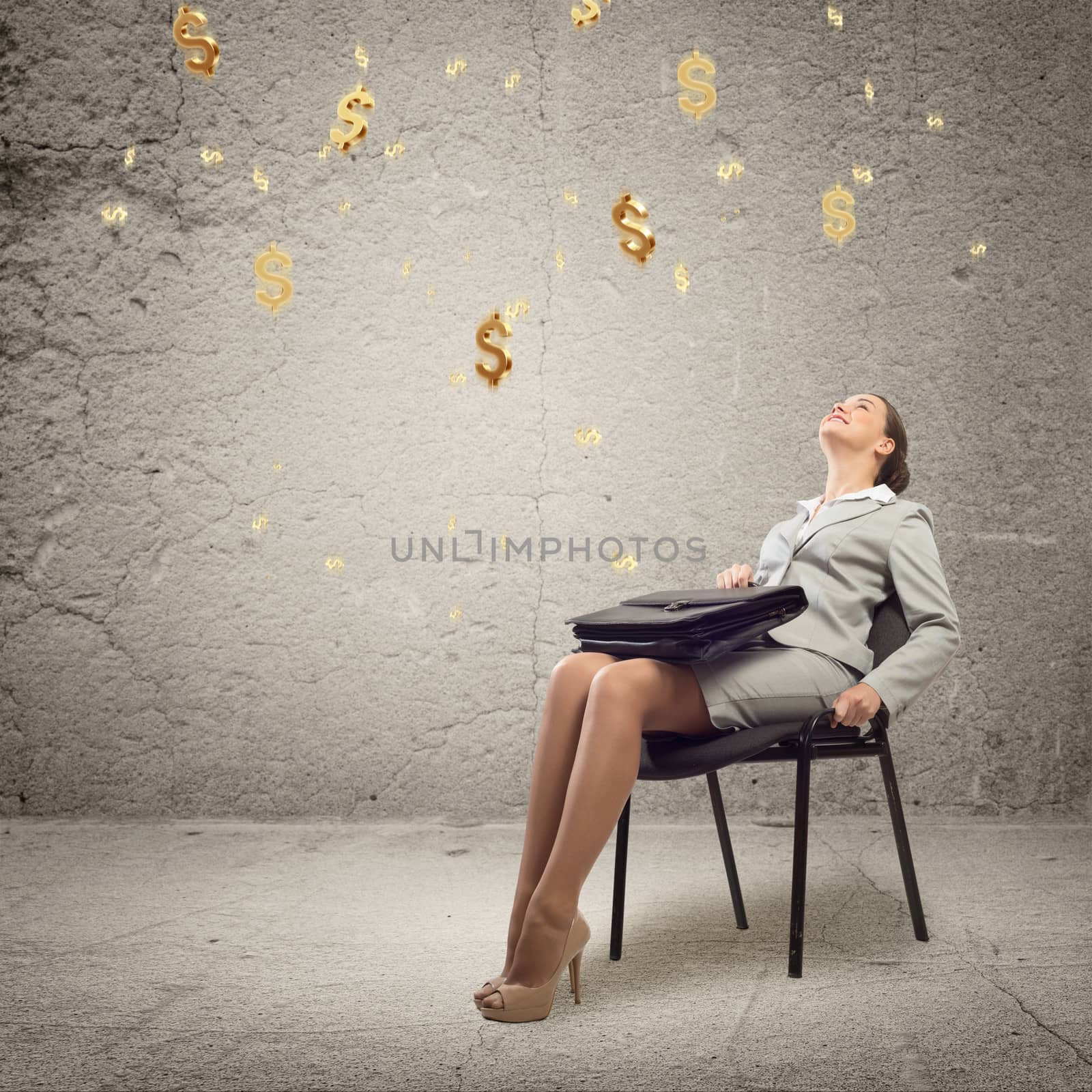 image of a young business woman looking at the falling business signs