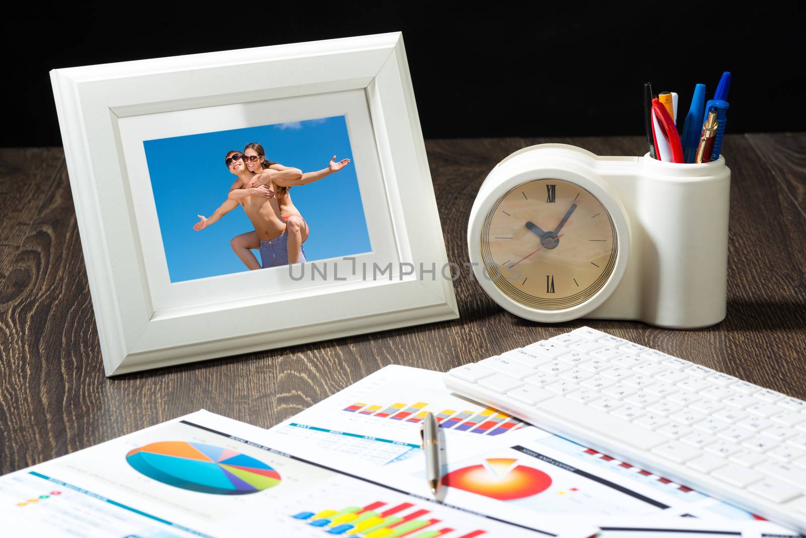 photo frame, business papers with financial charts. Workplace of the businessman.