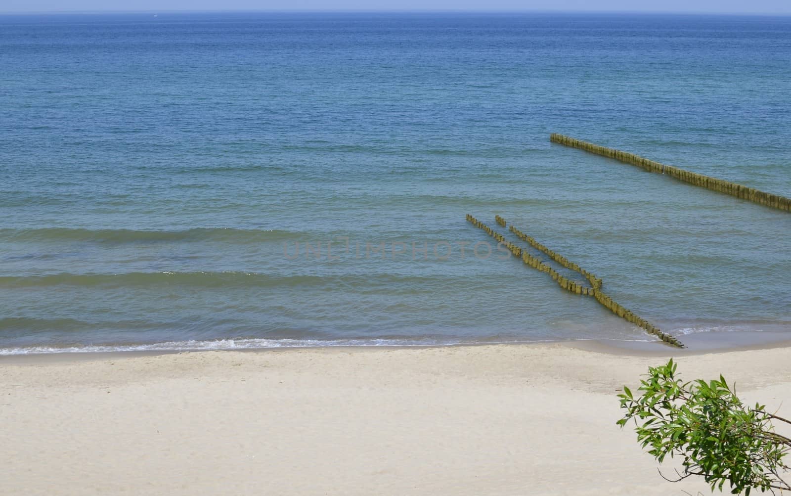 Baltic Sea,Breakwater and Beach in Summer Time by fstockluk