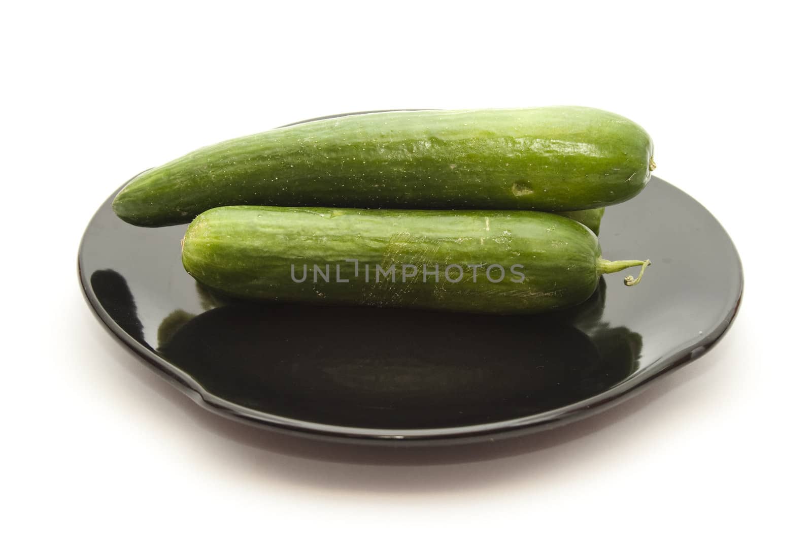 Fresh Cucumber on ceramic plate