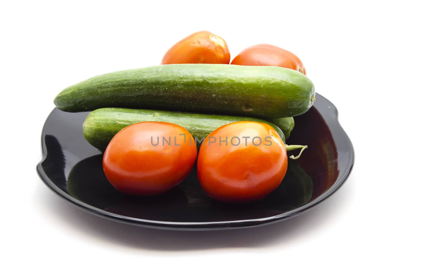 Fresh Cucumber with Red Tomatoes  on ceramic plate