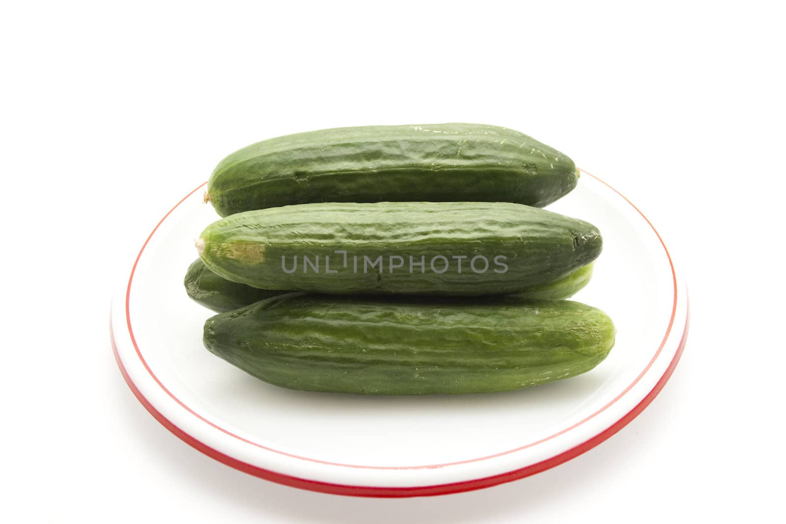 Fresh Green Cucumber on Plate by KEVMA21