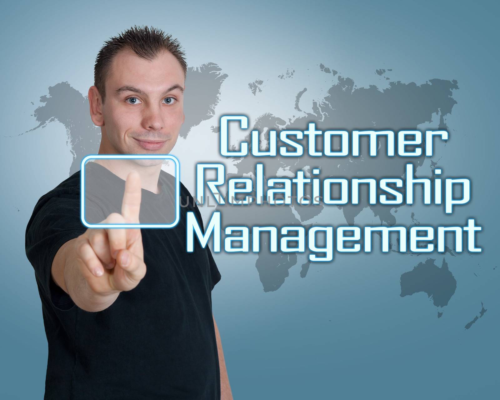 Young man press digital Customer Relationship Management button on interface in front of him