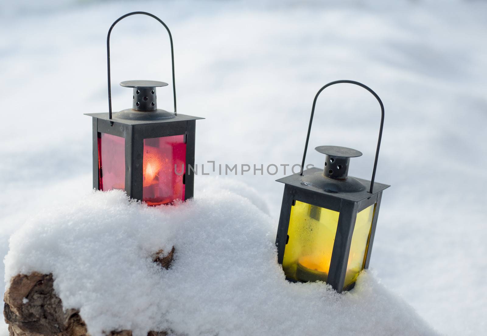 Two lamps set on the snow