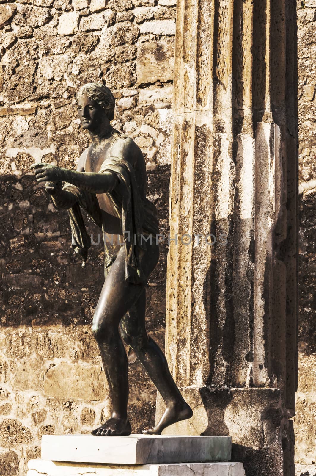 bronze statue inside the pompeii ruins, italy