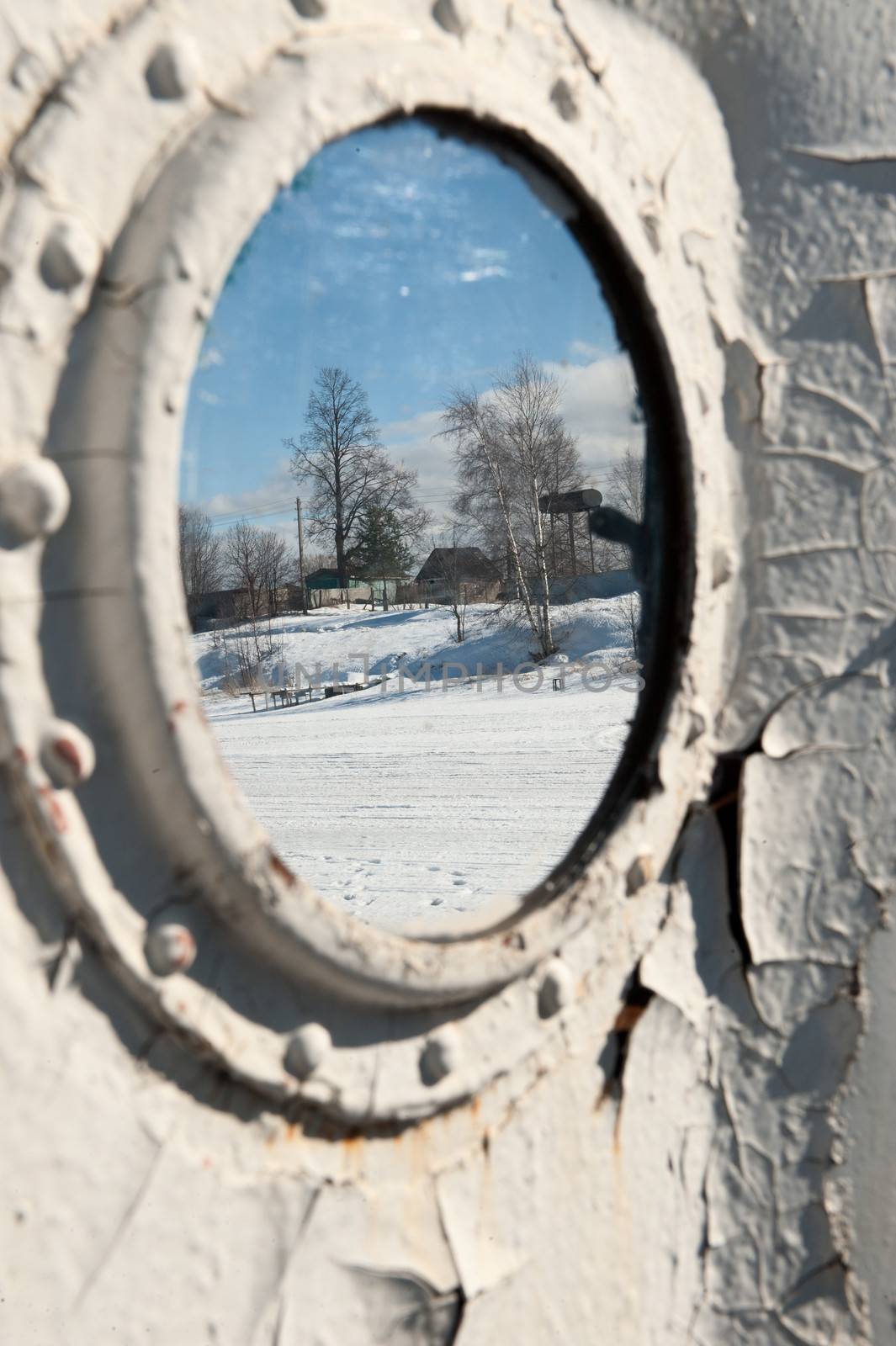 Frozen porthole on the white ships wall. by SURZ