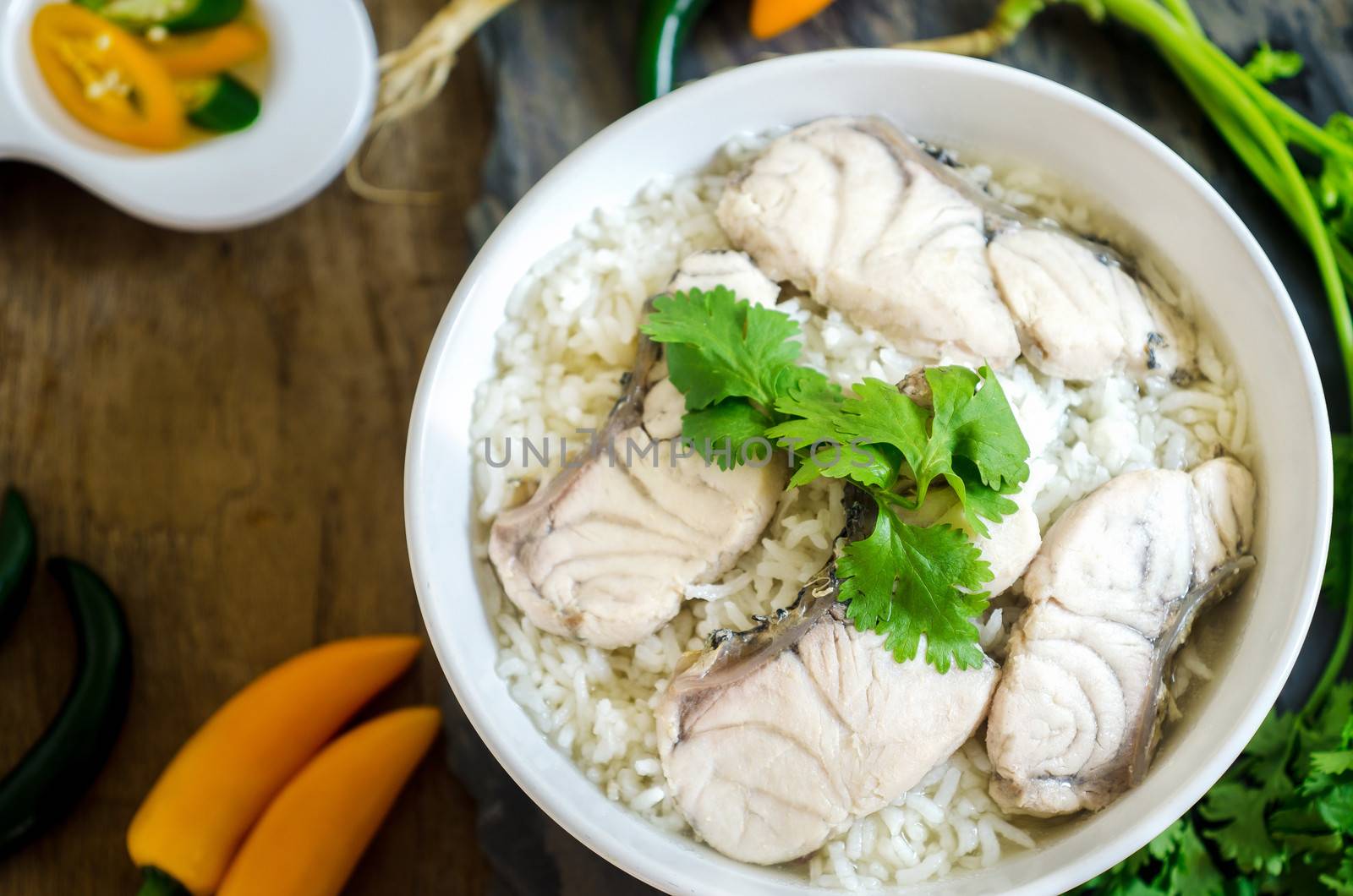 Rice Soup With sea  fish (Thai food) on wood