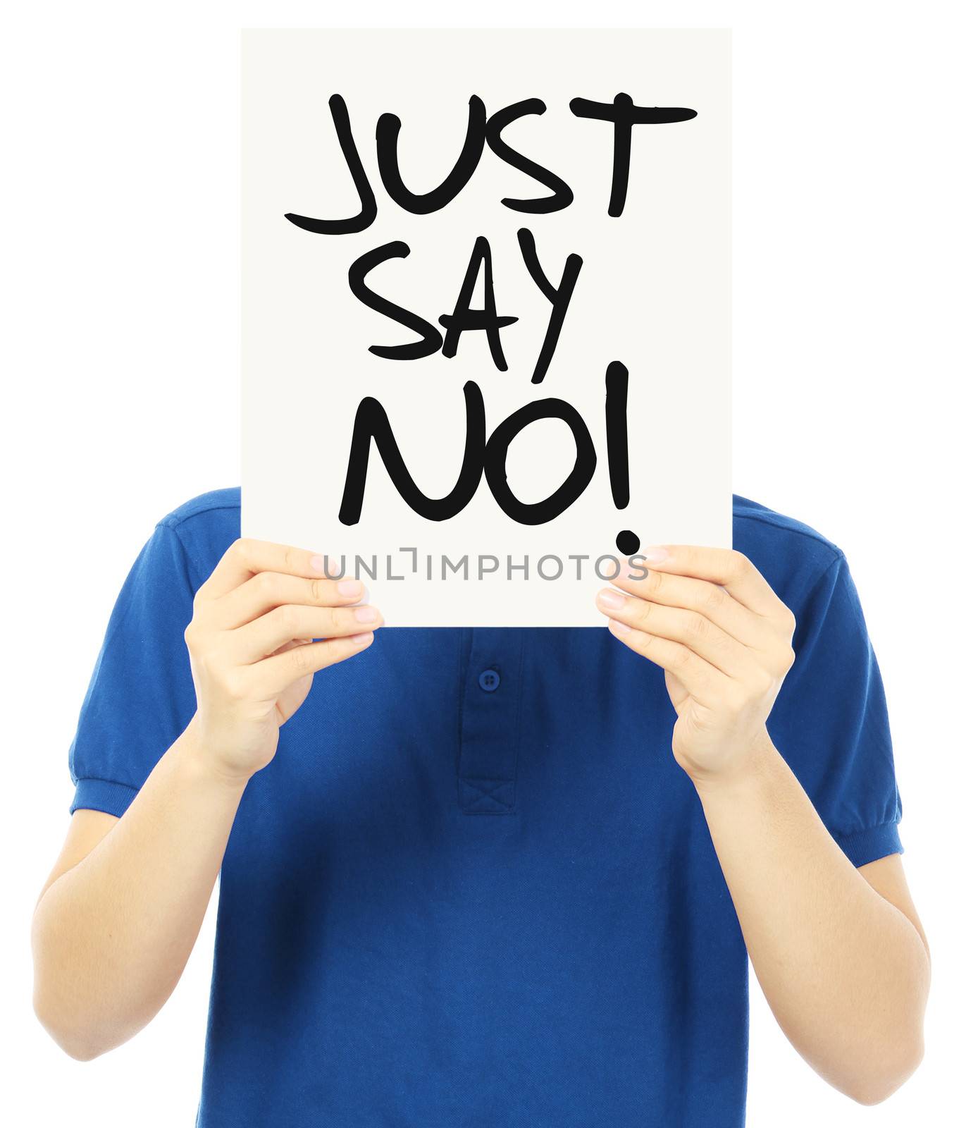 An unrecognizable young man holding up a signboard indicating Just Say No