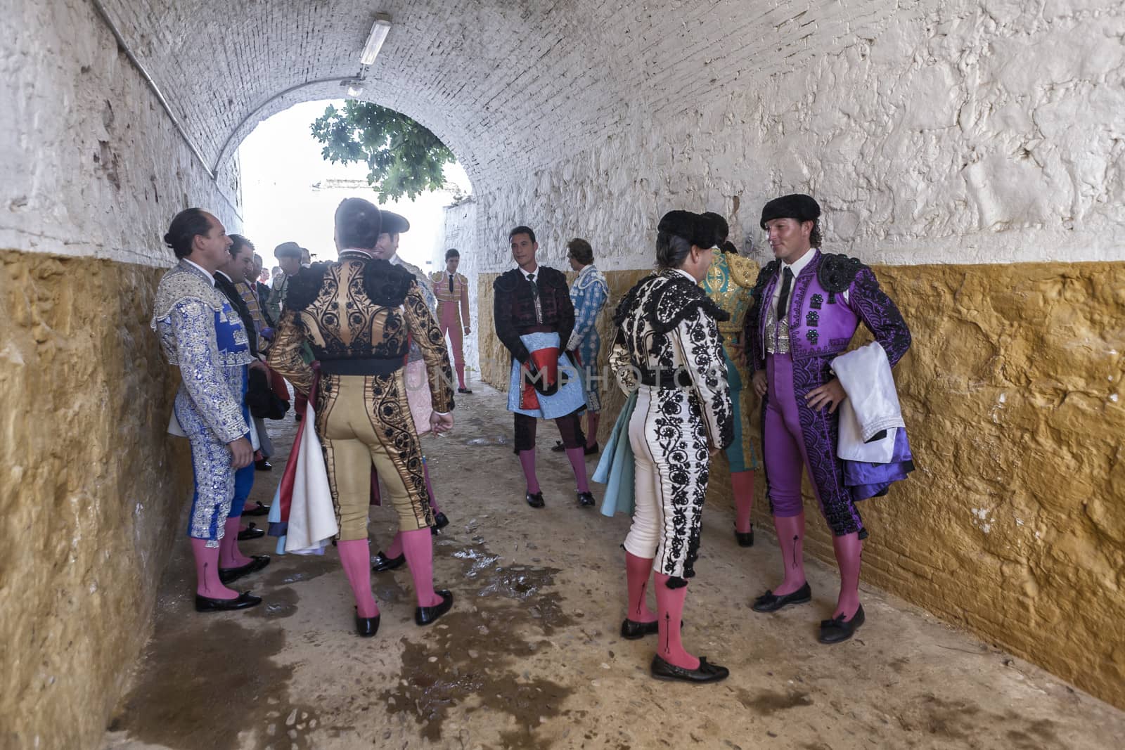 Andujar, Jaen province, SPAIN - 10 september 2011: Bullfighters speaking on the alley waiting to come out to the bullring, Andujar, Jaen province, Andalusia, Spain