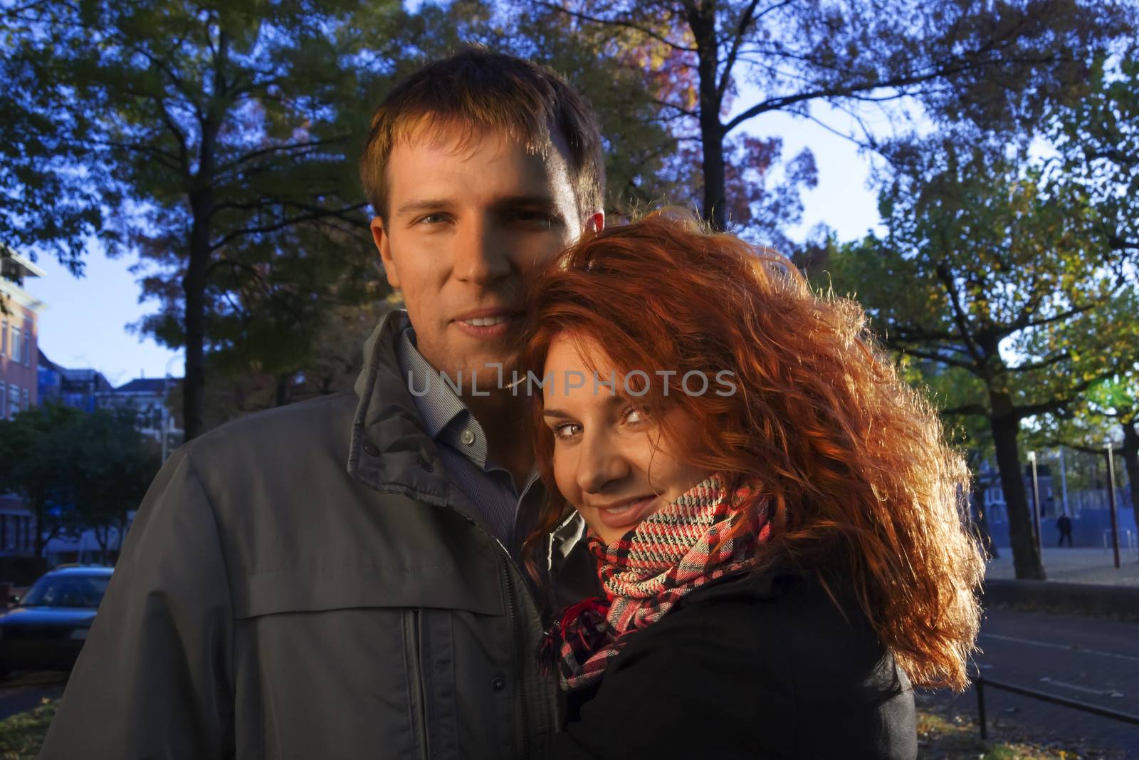 Outdoor happy couple in love, Museum Plein, autumn Amsterdam bac by Tetyana