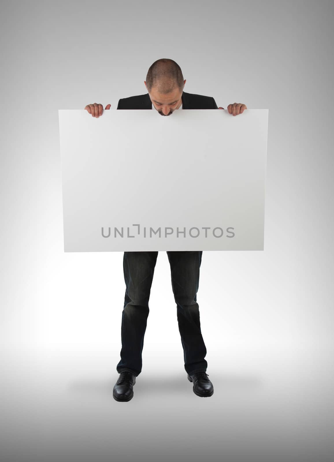 Businessman holding a big card, isolated on white