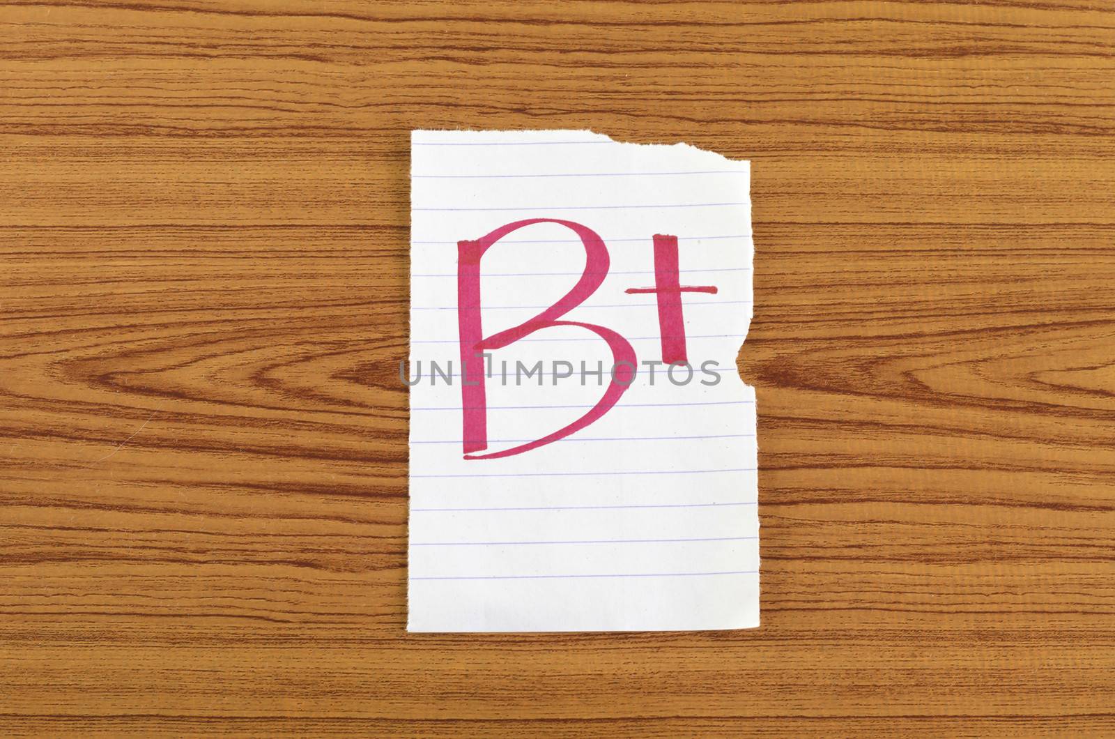 grade b plus on wood wall background