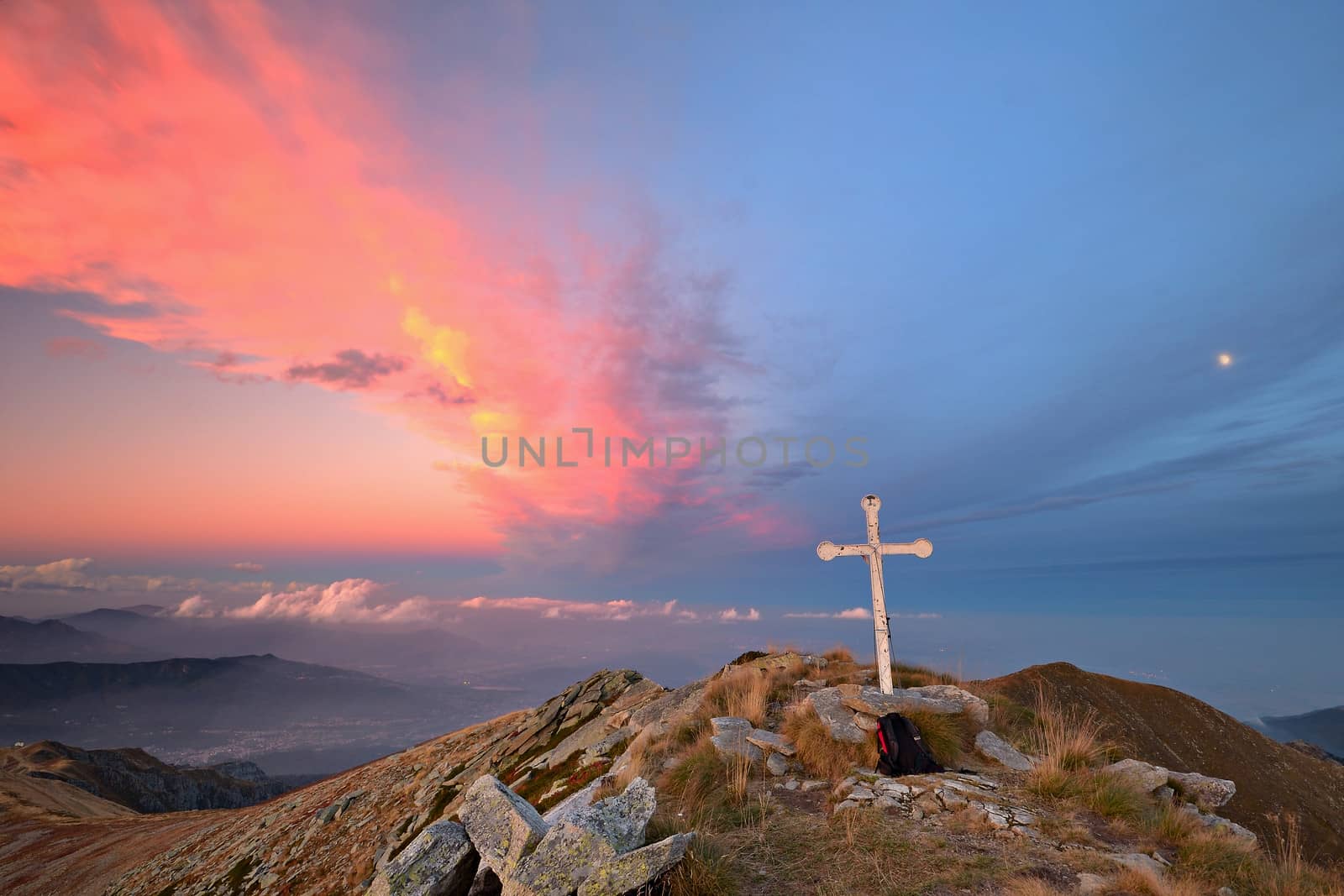 Stunning landscape and romantic cloudscape at sunset in the italian Alps