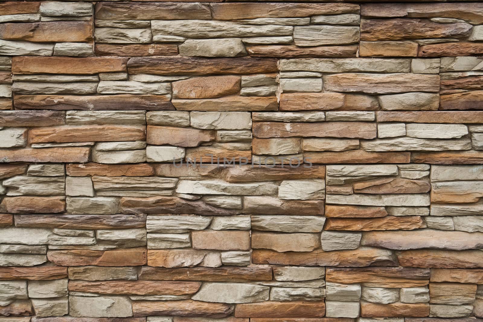 Brown shades color decorative design uneven stone stucco wall
