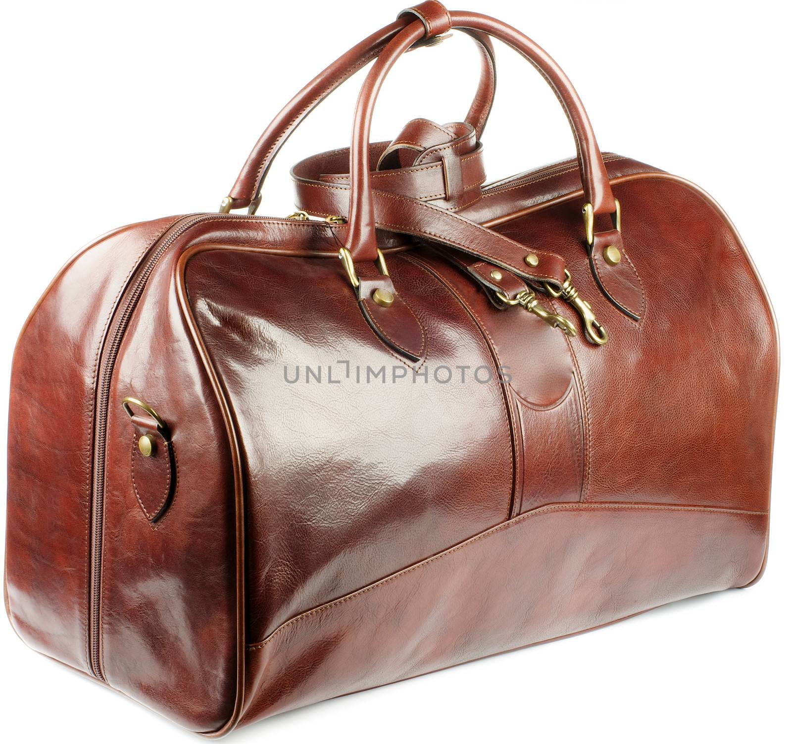 Big Ginger Leather Traveling Bag with Gold Details and Handles isolated on white background