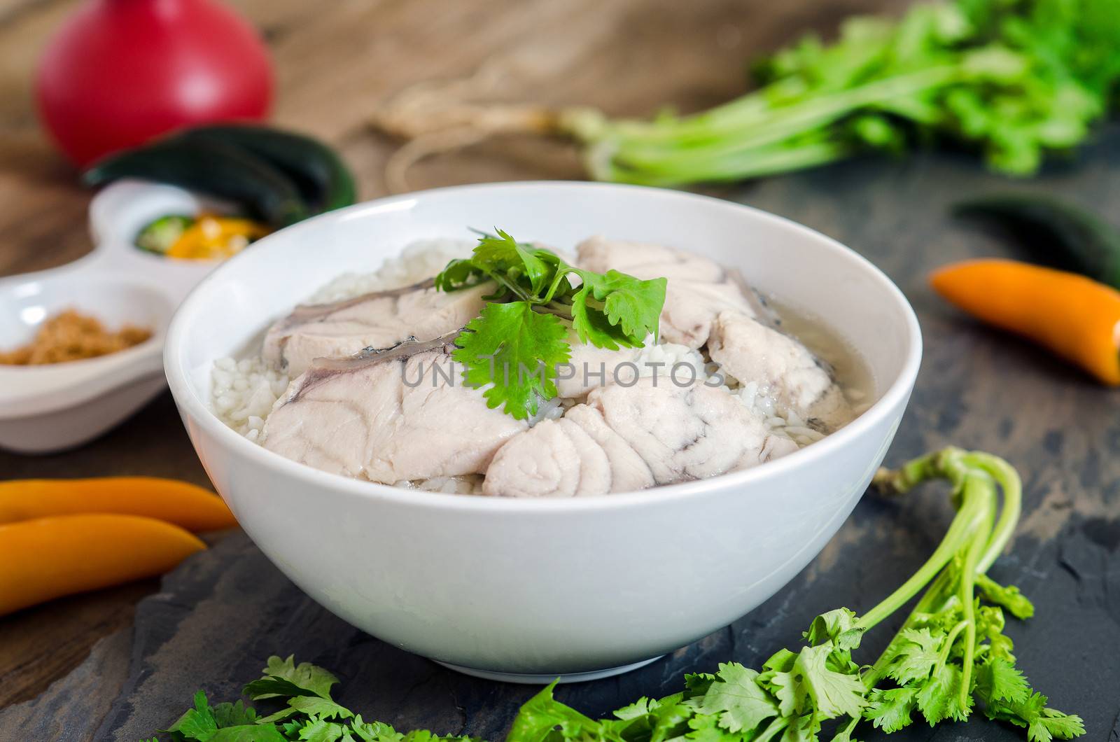 Rice Soup With sea  fish (Thai food) on wood