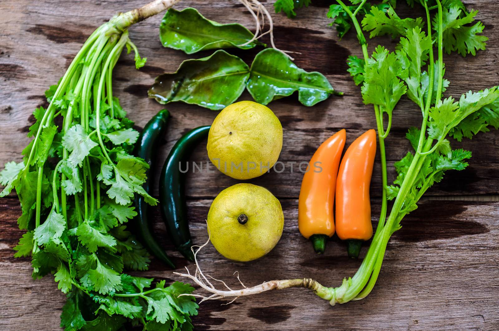 an assortment of mixed and fruits vegetables  on wooden table