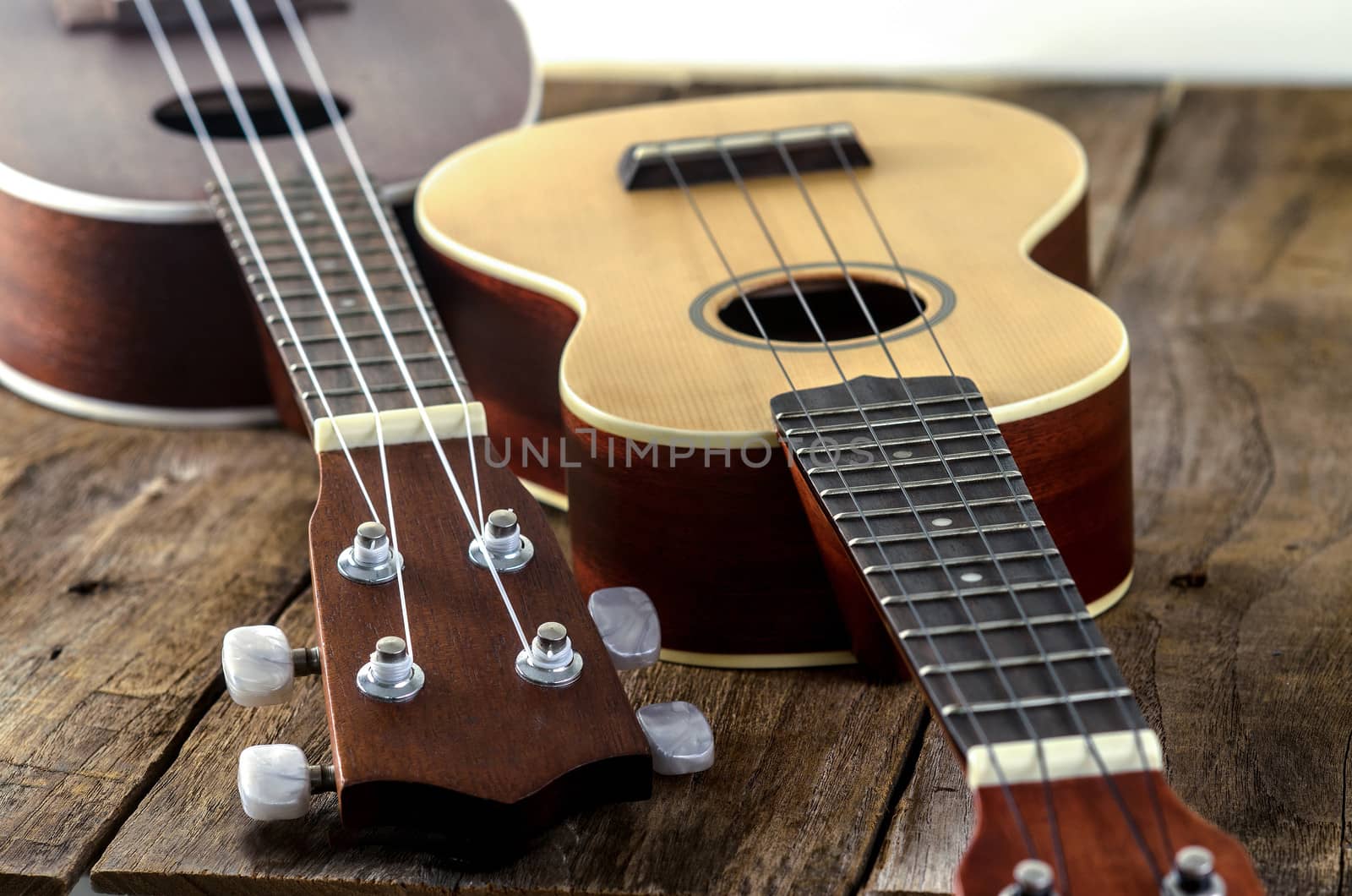 ukuleles  on  wooden background.