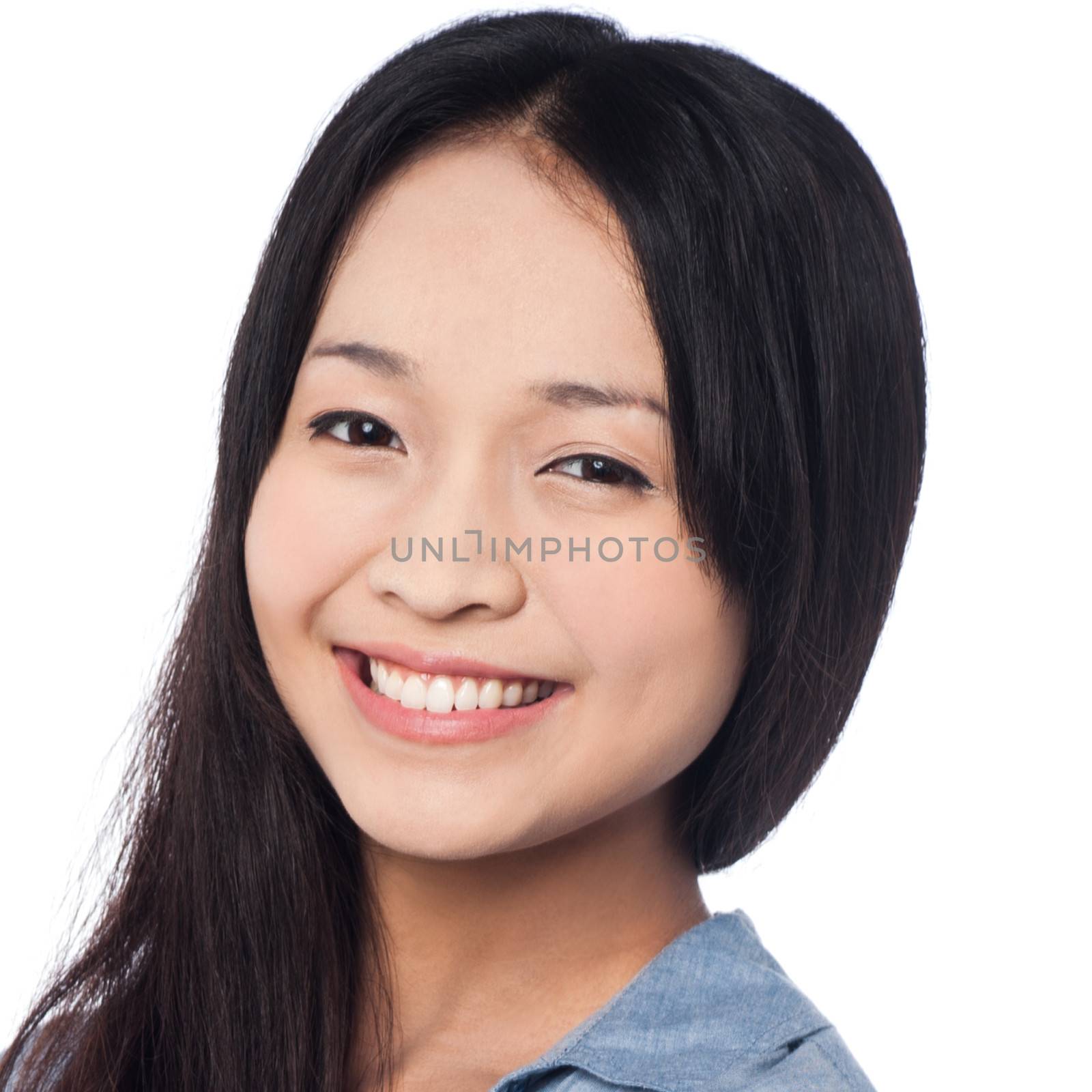 Young smiling chinese woman posing casually by stockyimages