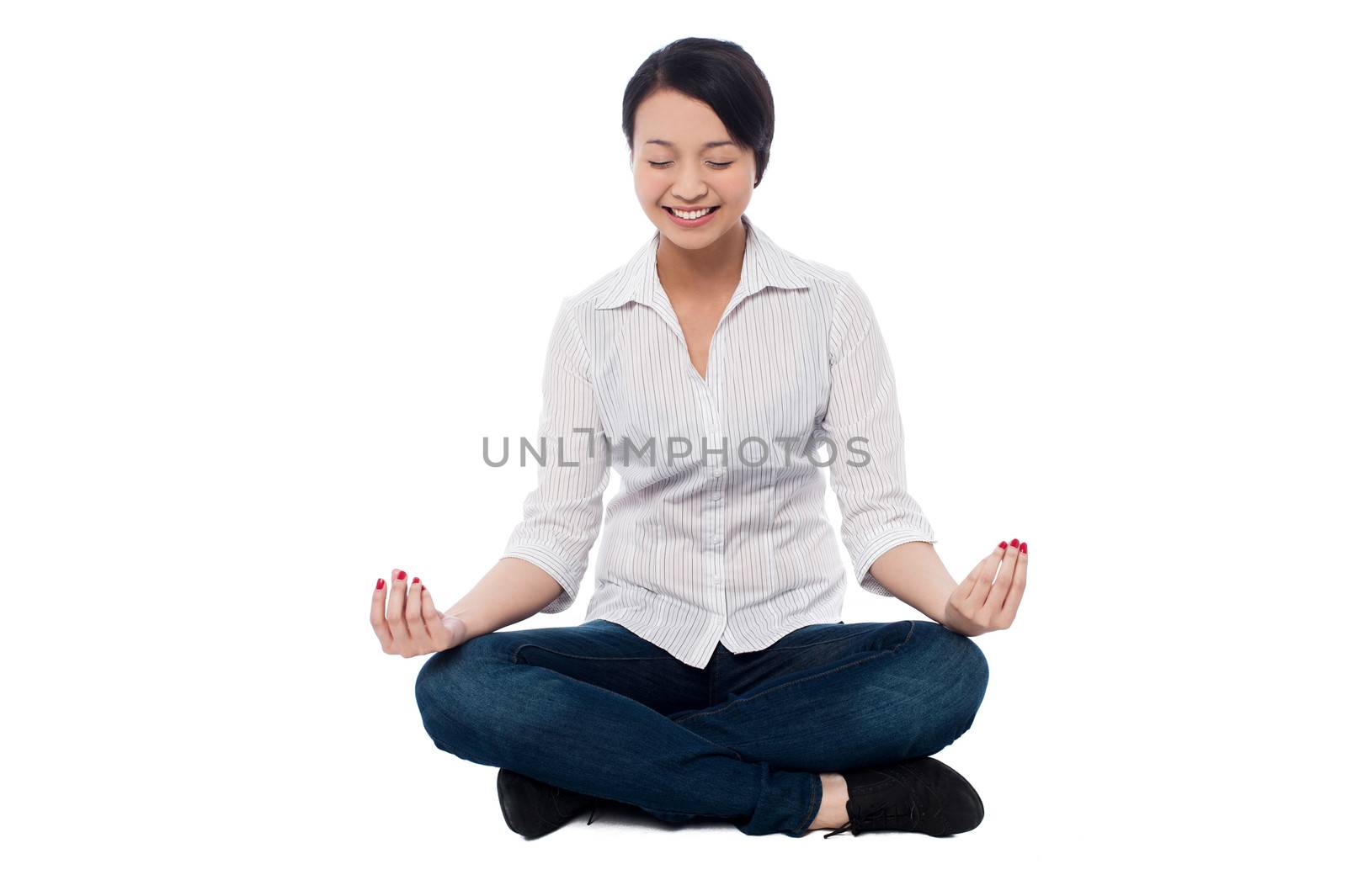 Beautiful woman sitting on the floor and doing medidation
