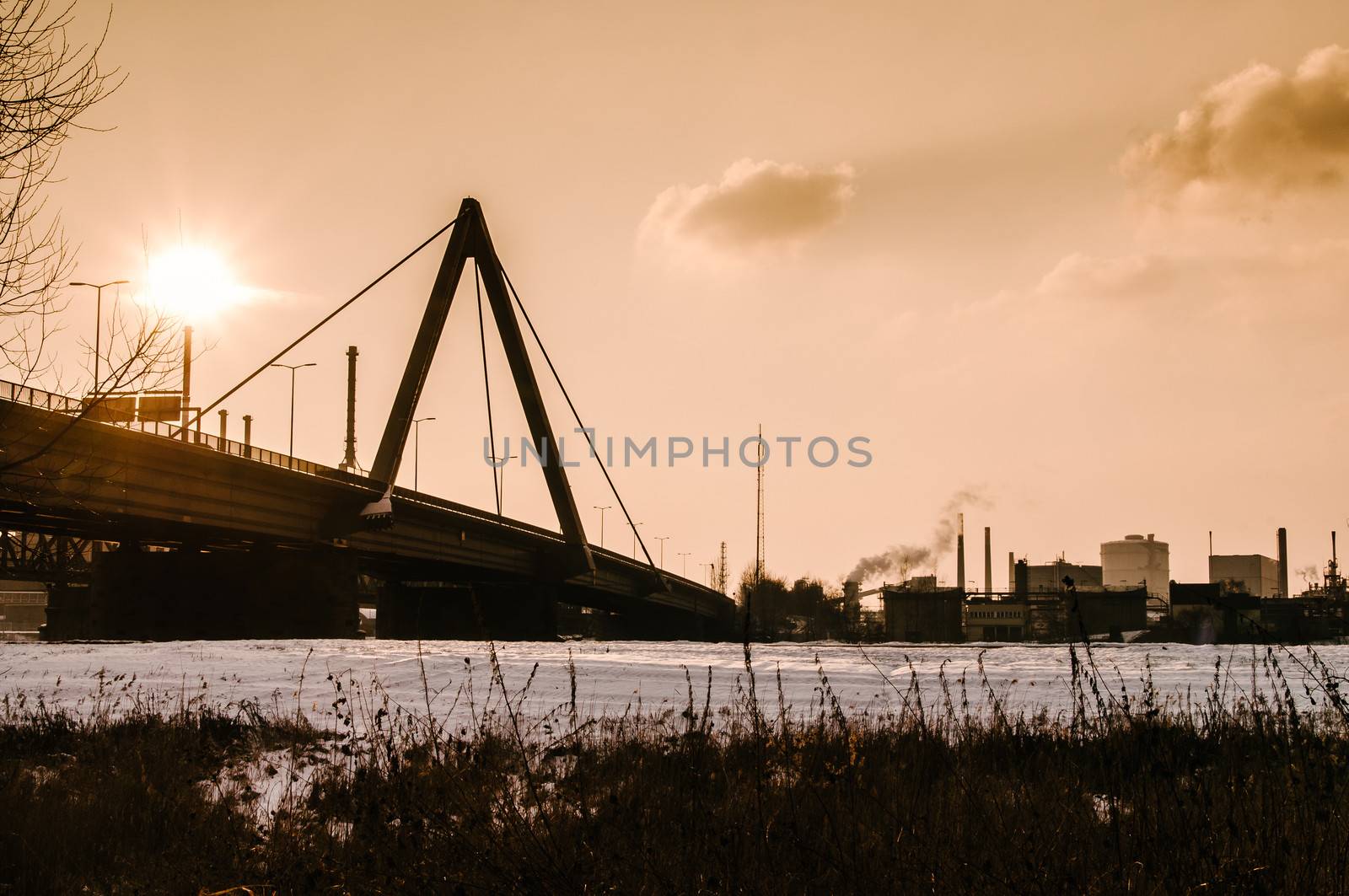 Bridge and steel industry on late afternoon