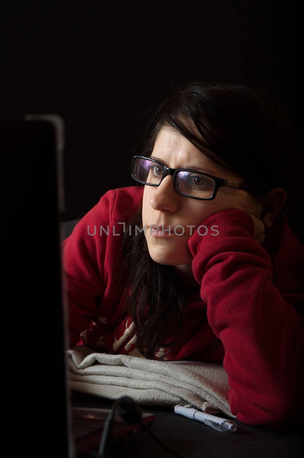 Girl in red sweater using notebook