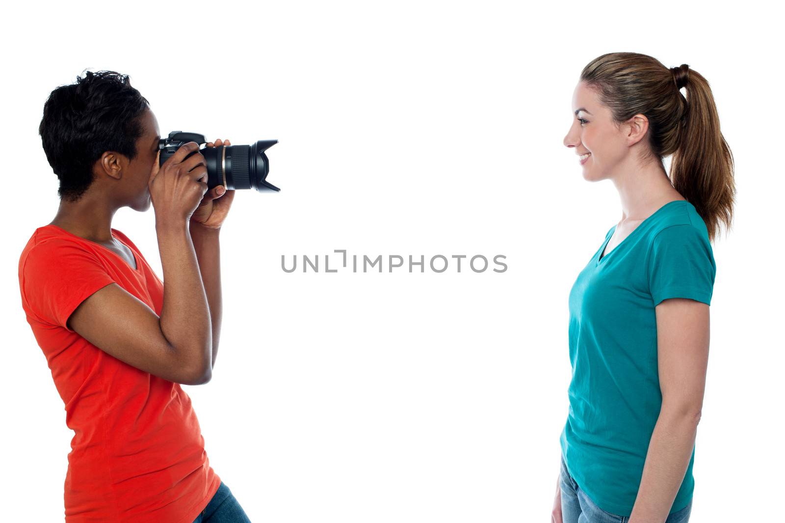 Woman taking a picture of her friend