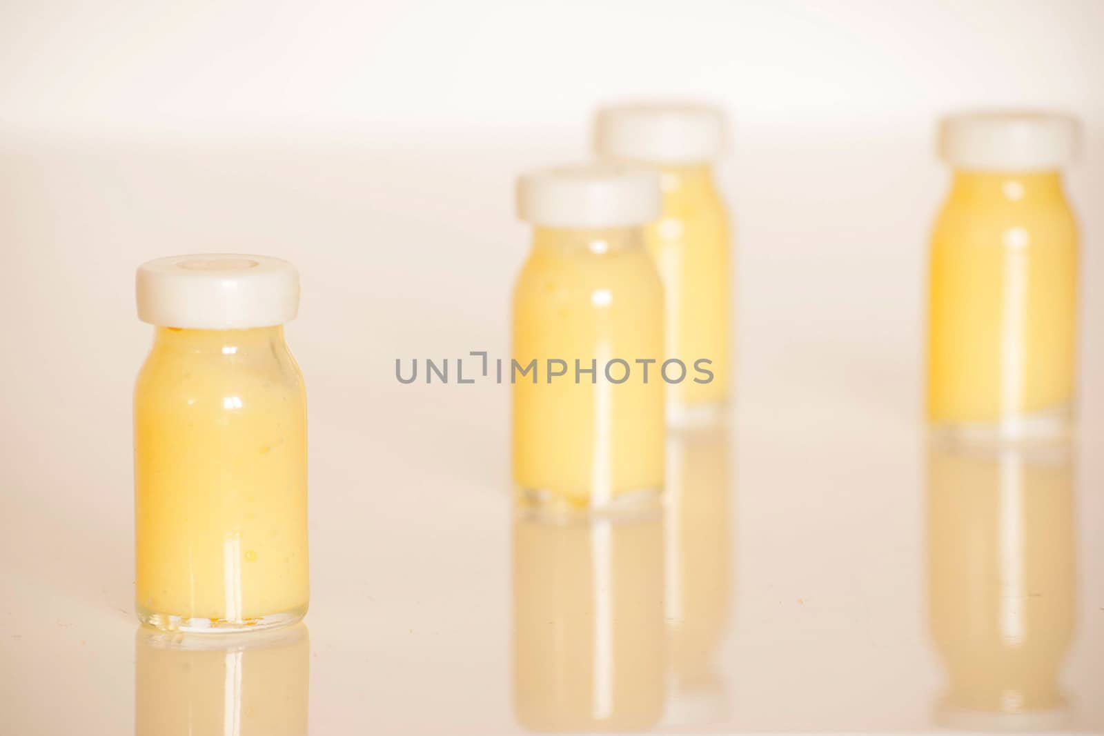 raw organic royal jelly in a small bottle