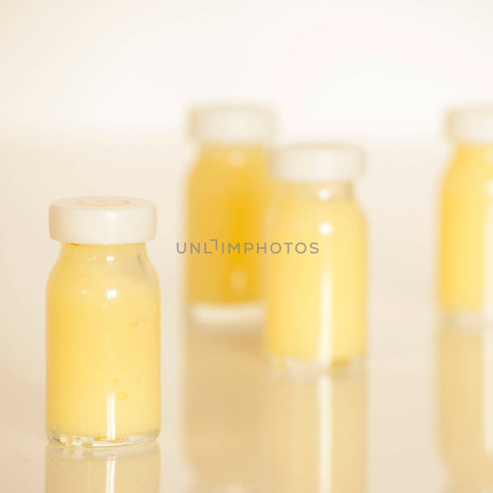 raw organic royal jelly in a small bottle