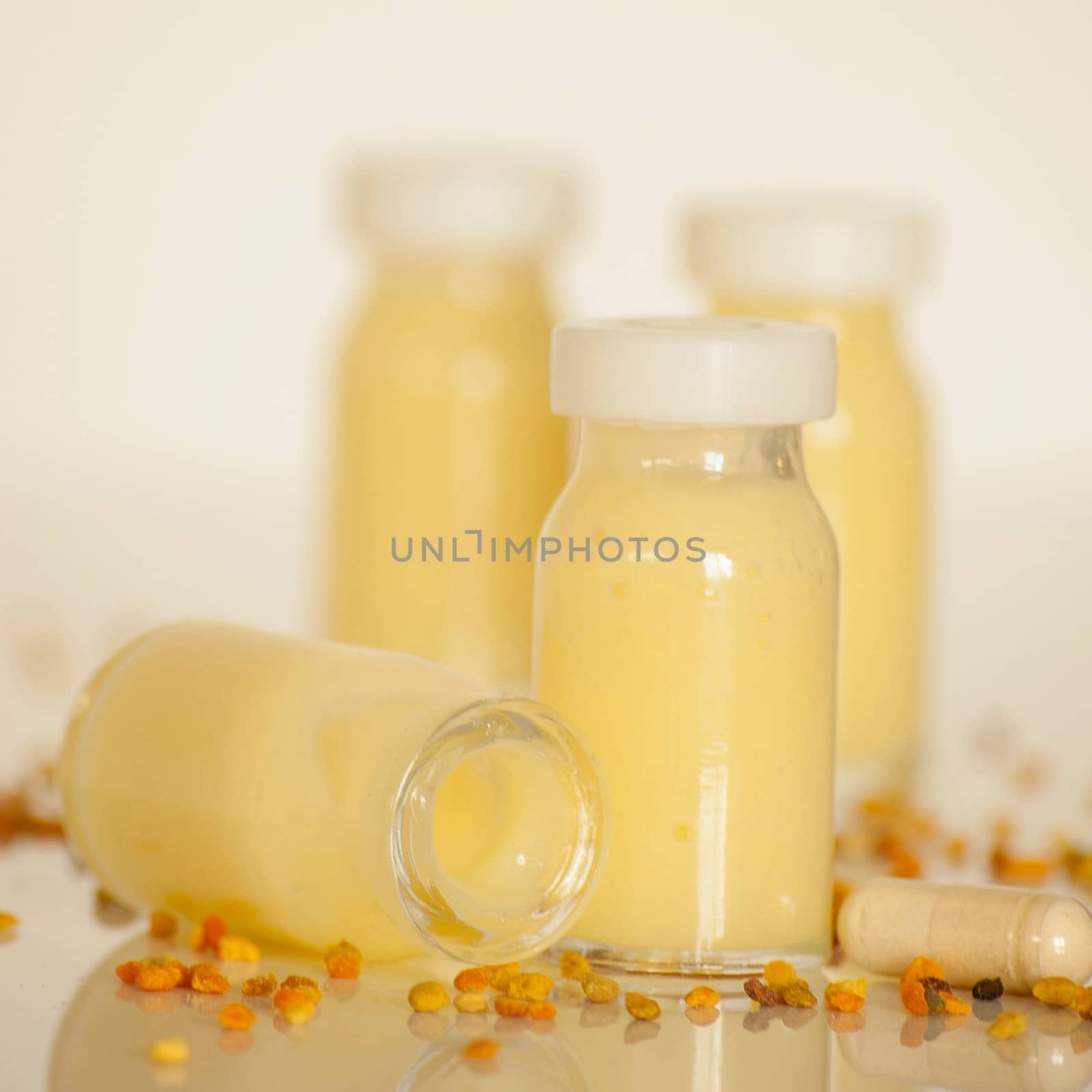 raw organic royal jelly in a small bottle