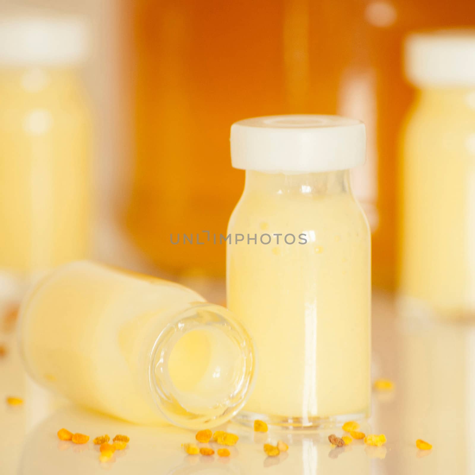 raw organic royal jelly in a small bottle