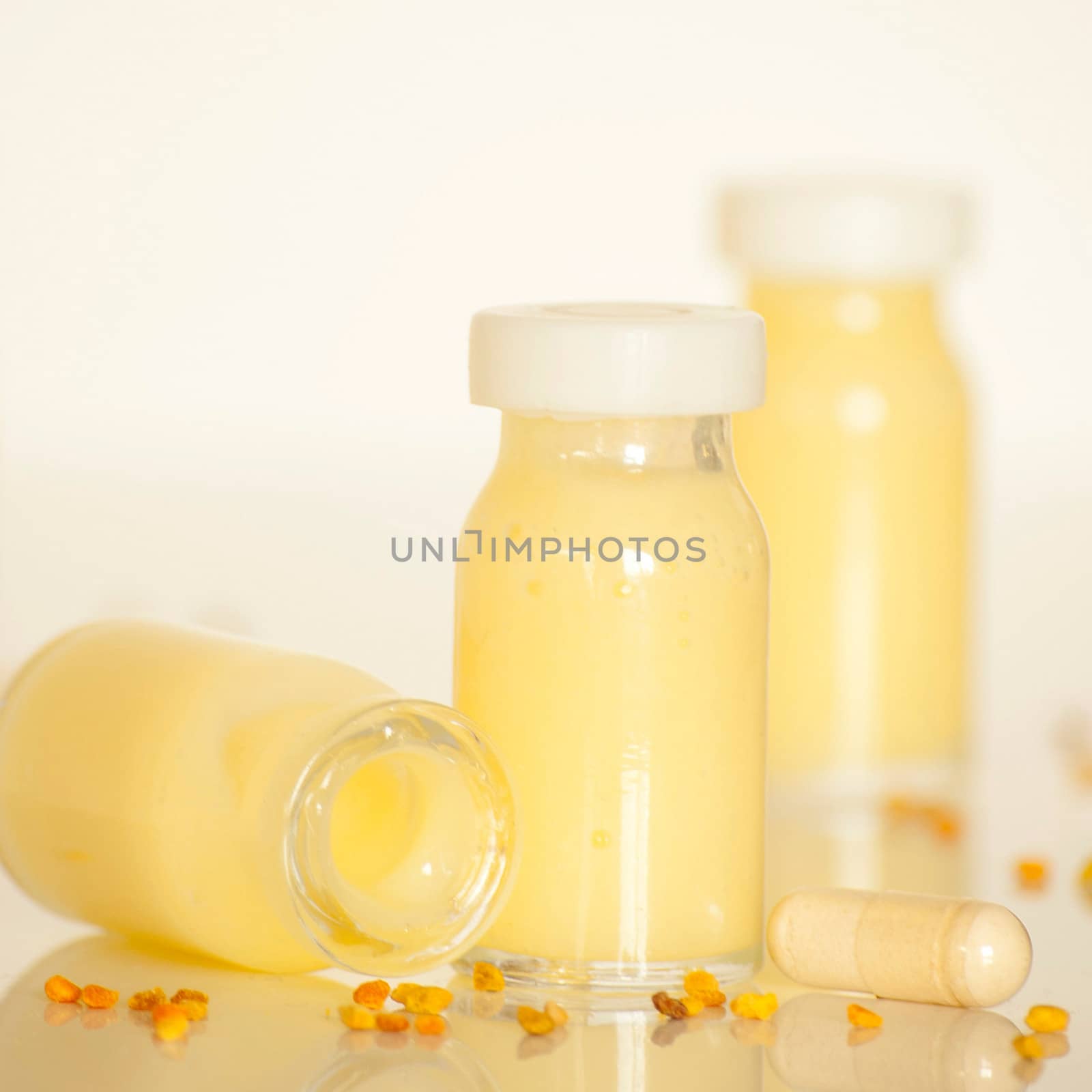 raw organic royal jelly in a small bottle