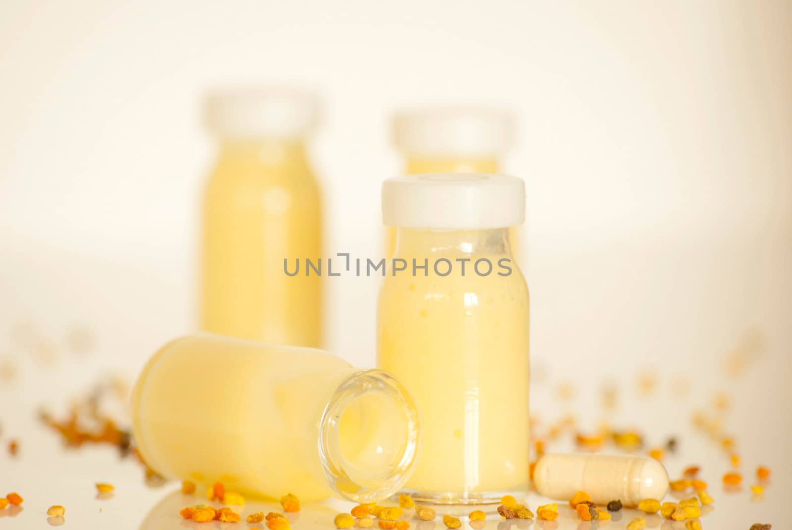 raw organic royal jelly in a small bottle