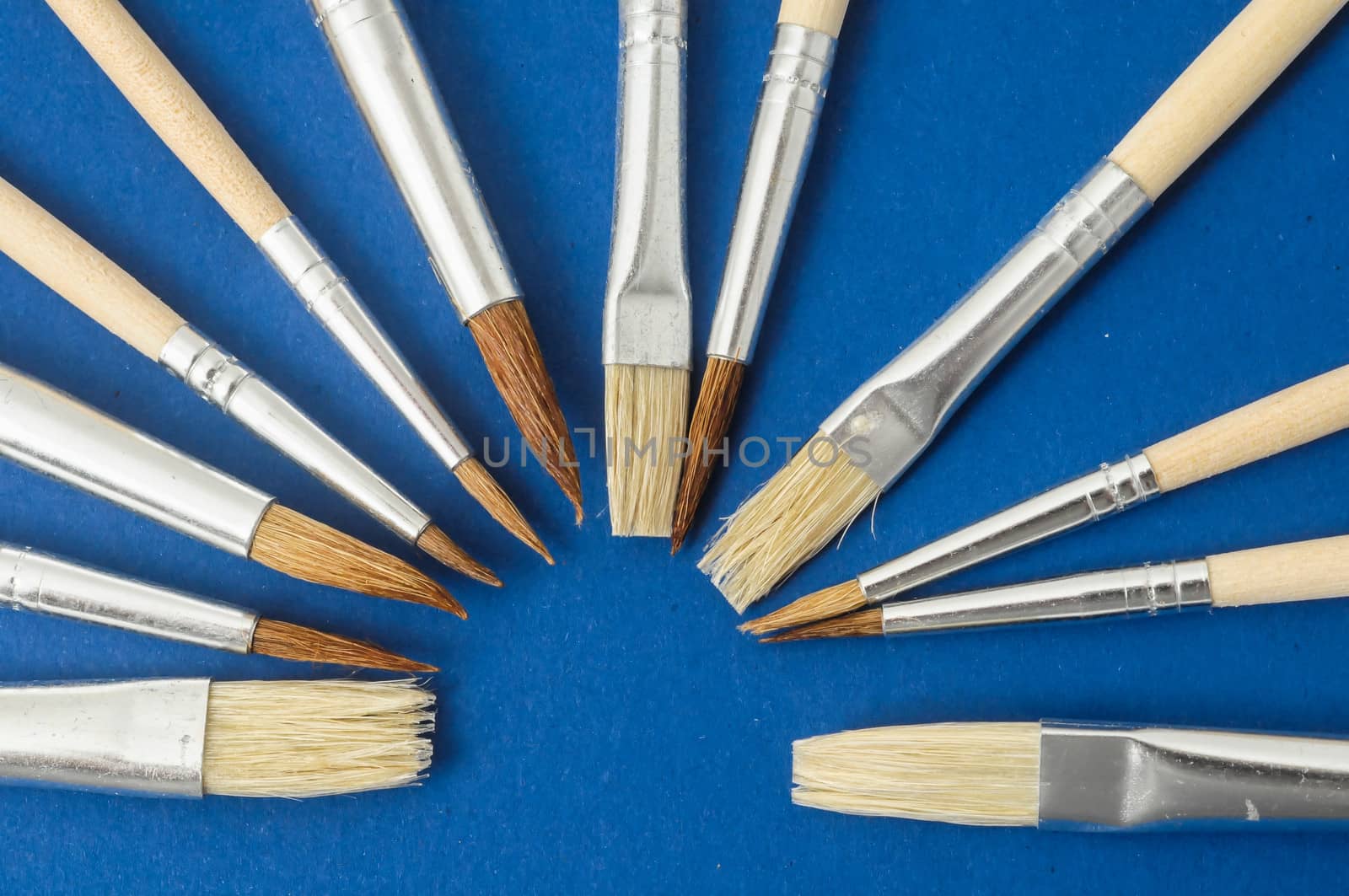 New Wooden Different Paintbrush Set Texture over a Colored Background