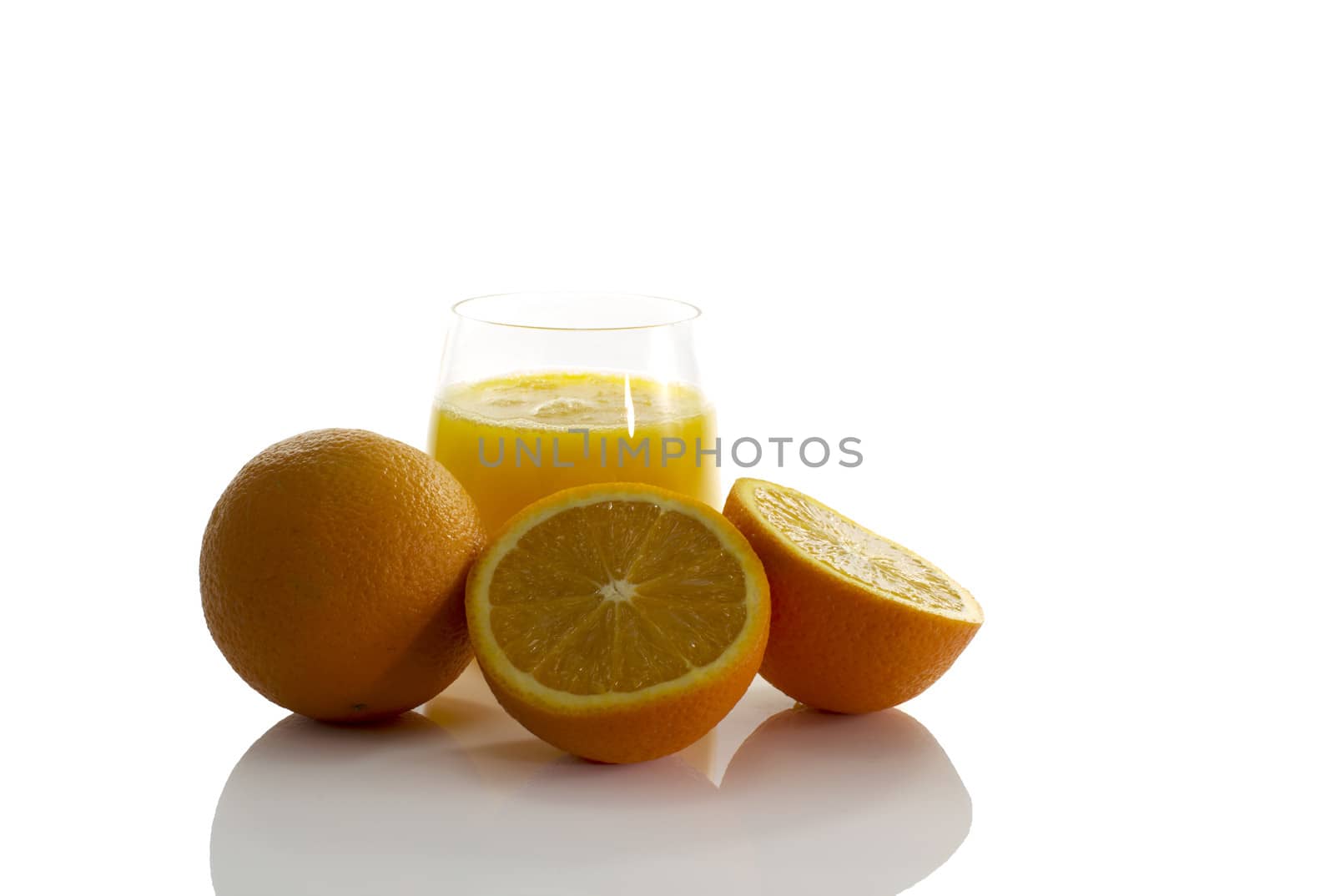 glass with fresh orange juice isolate on white