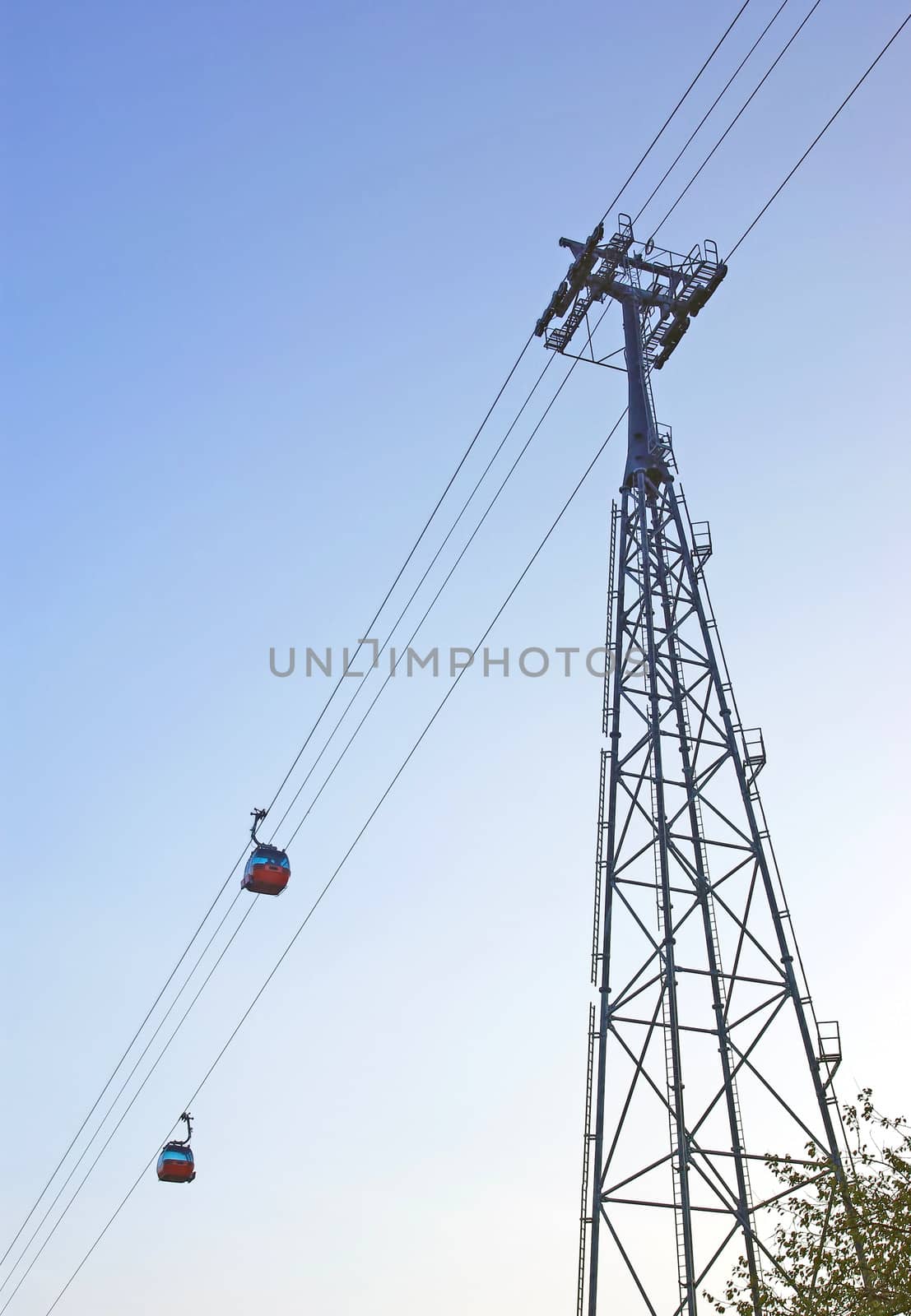 Gondola ropeway over the blue sky.