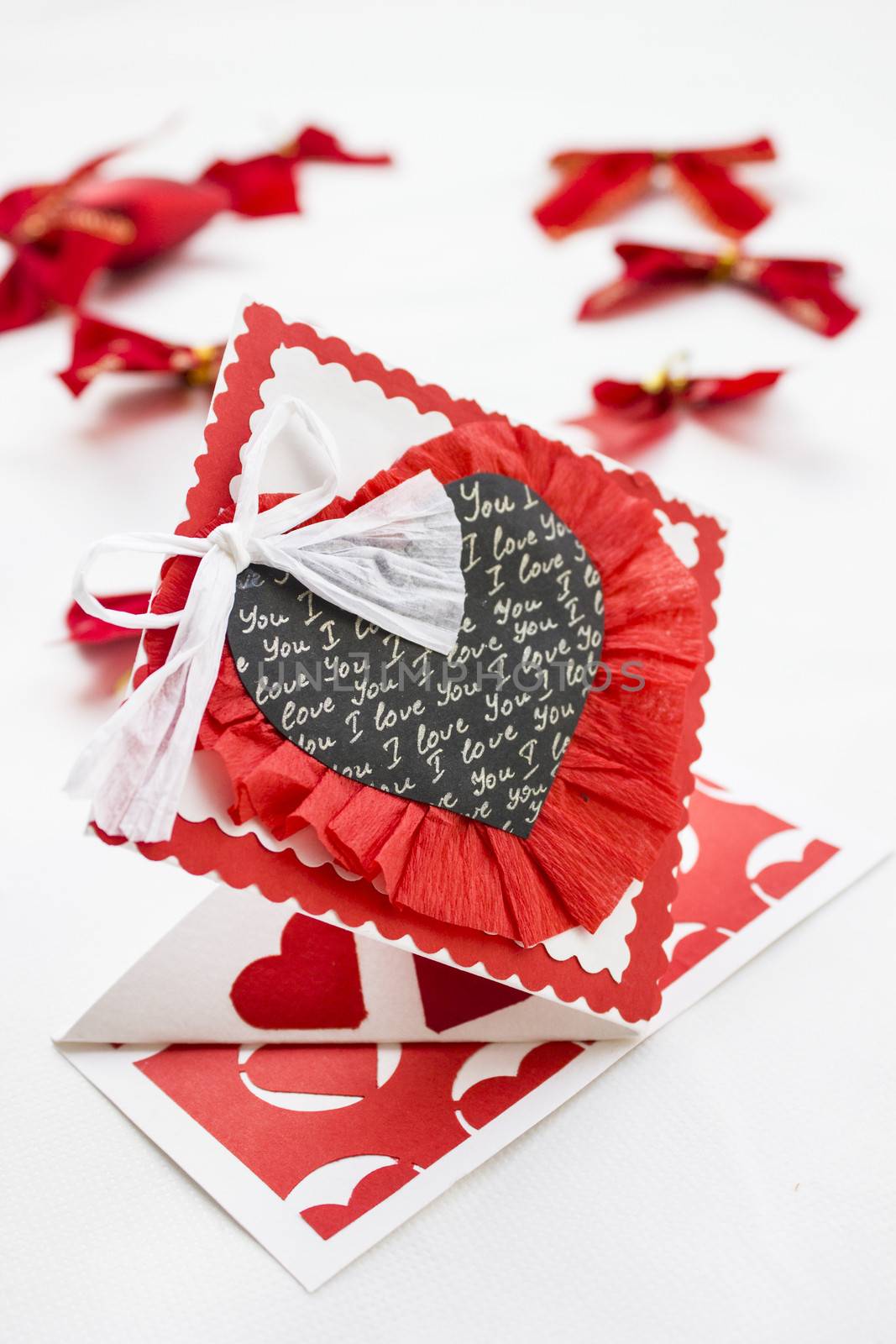 3D origami card with a black colored heart and a white ribbon.