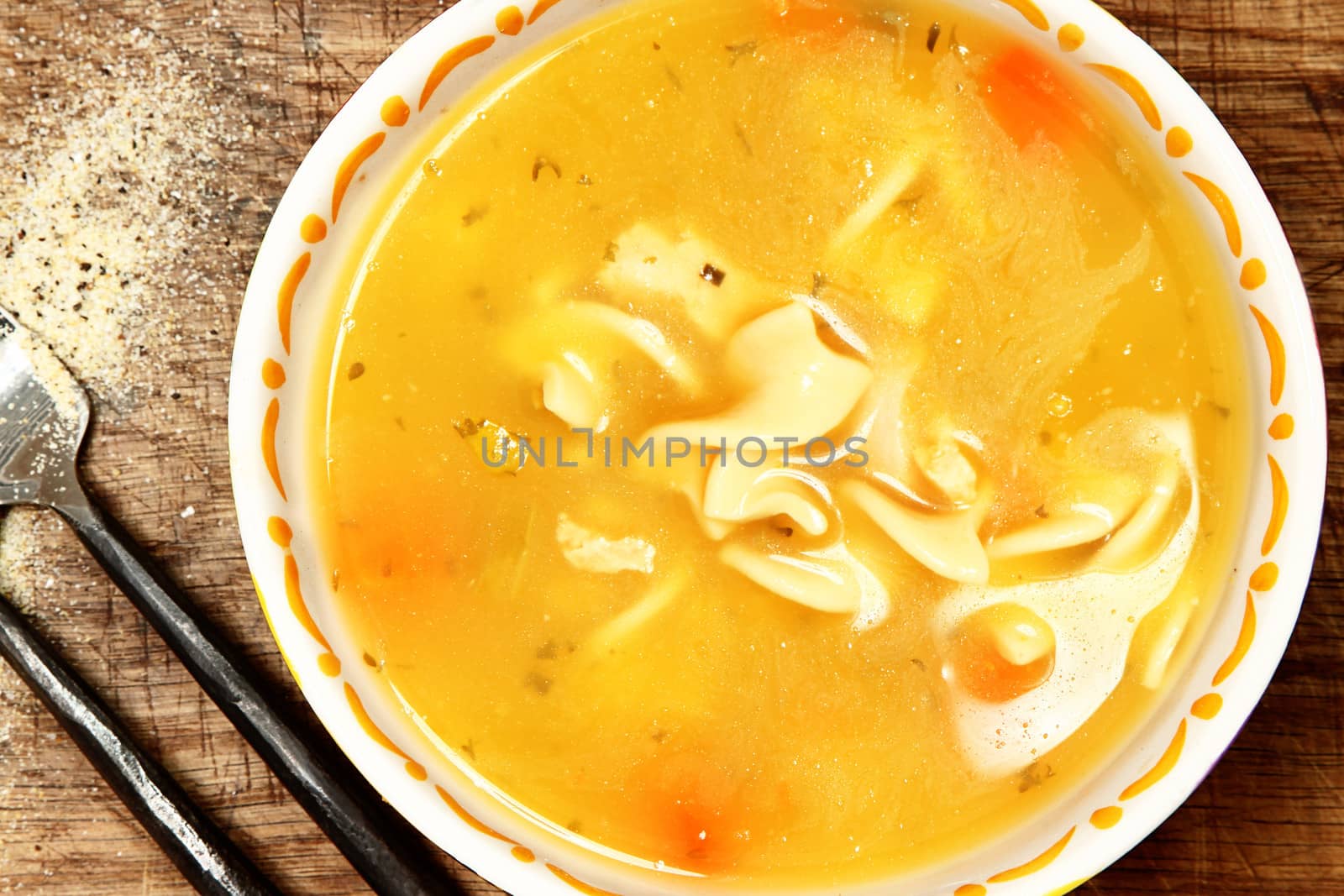 Canned Chicken Noodle Soup in Bowl on Table by duplass