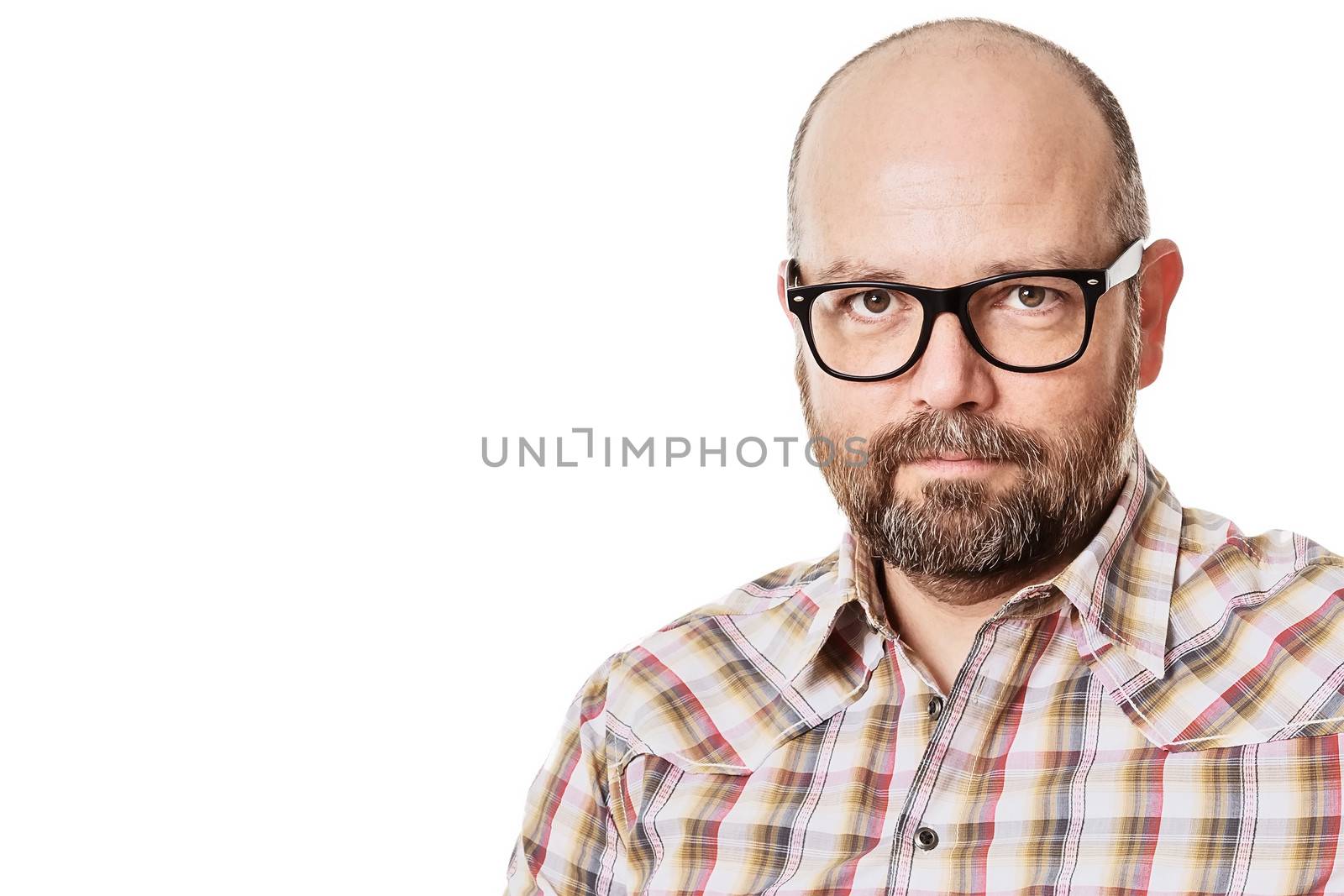 An image of a handsome man with a beard and glasses