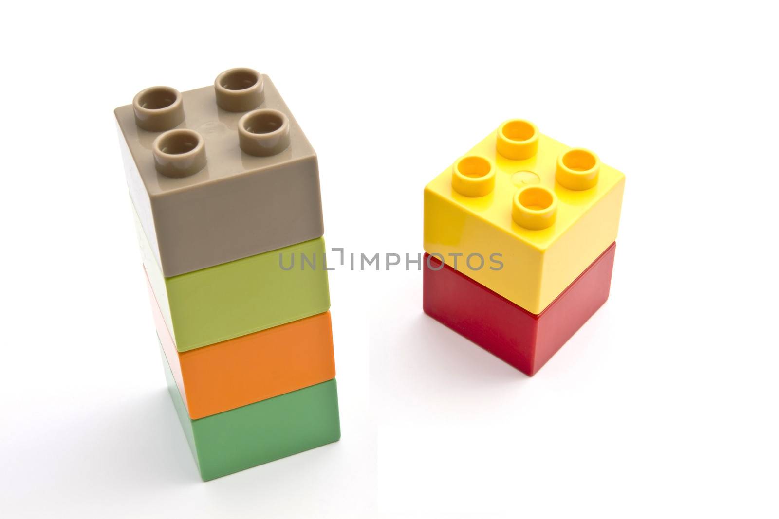 Colorful building blocks closeup on white